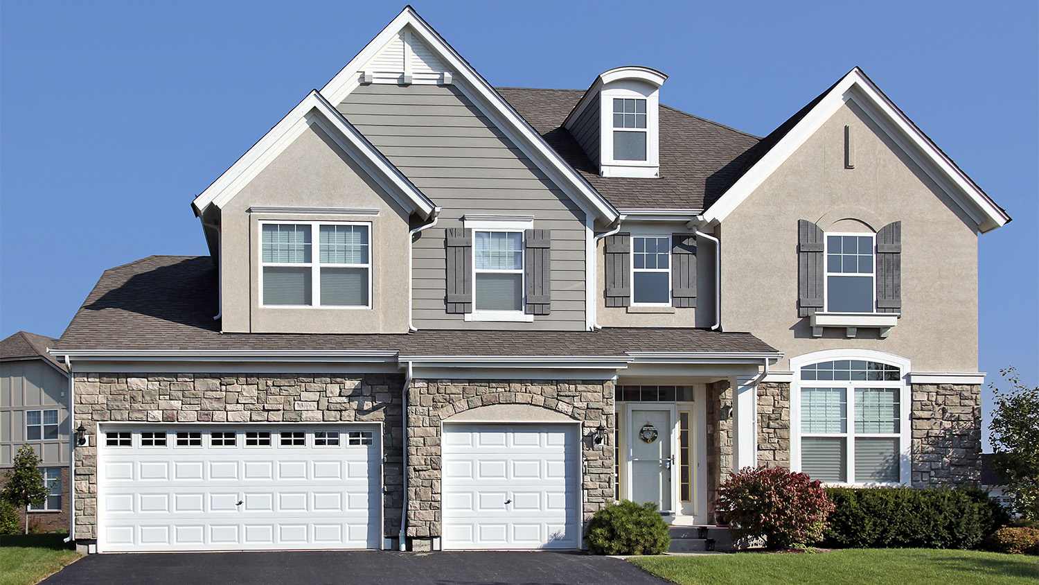 home with asphalt driveway
