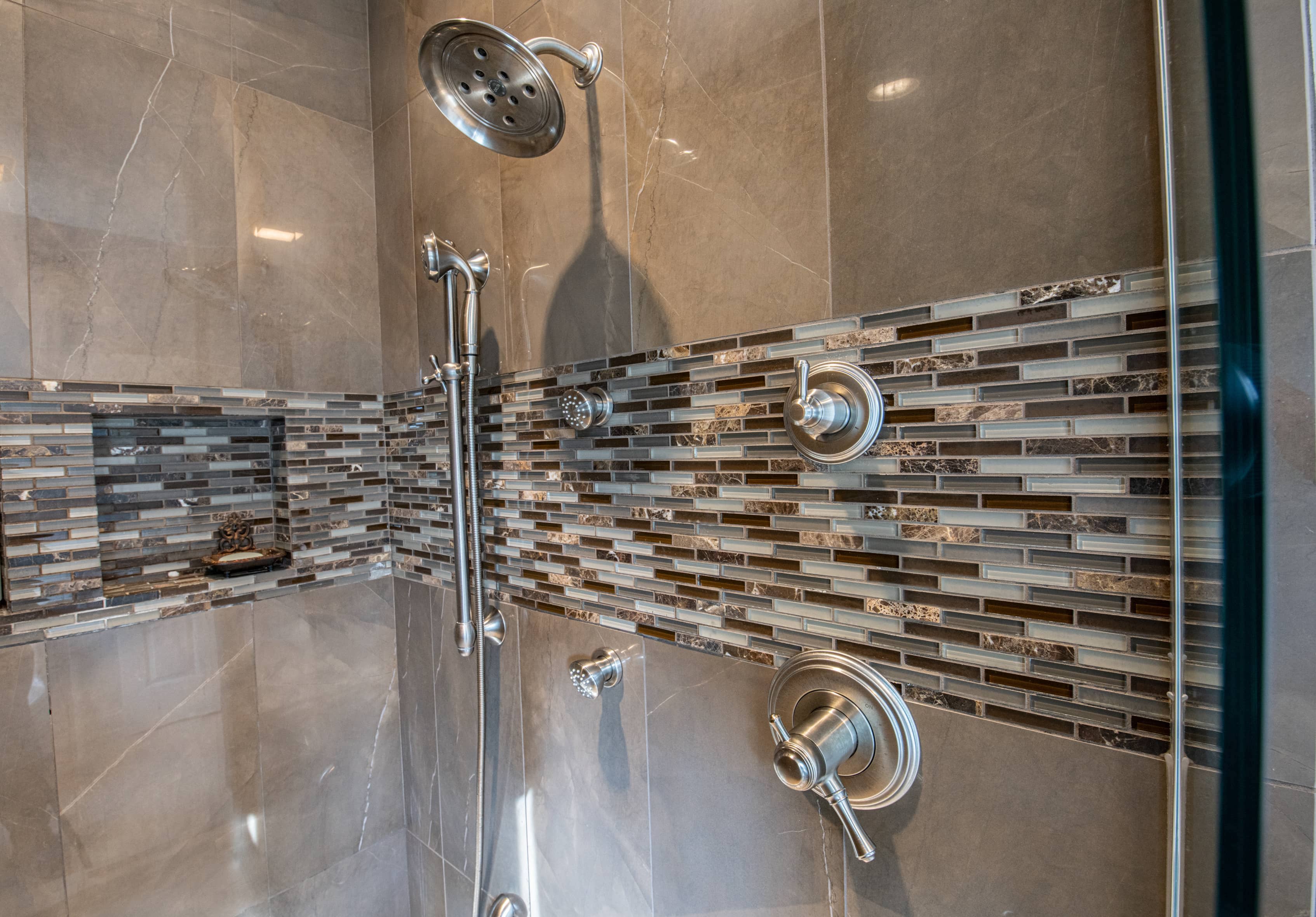 Metallic accent tiles in shower