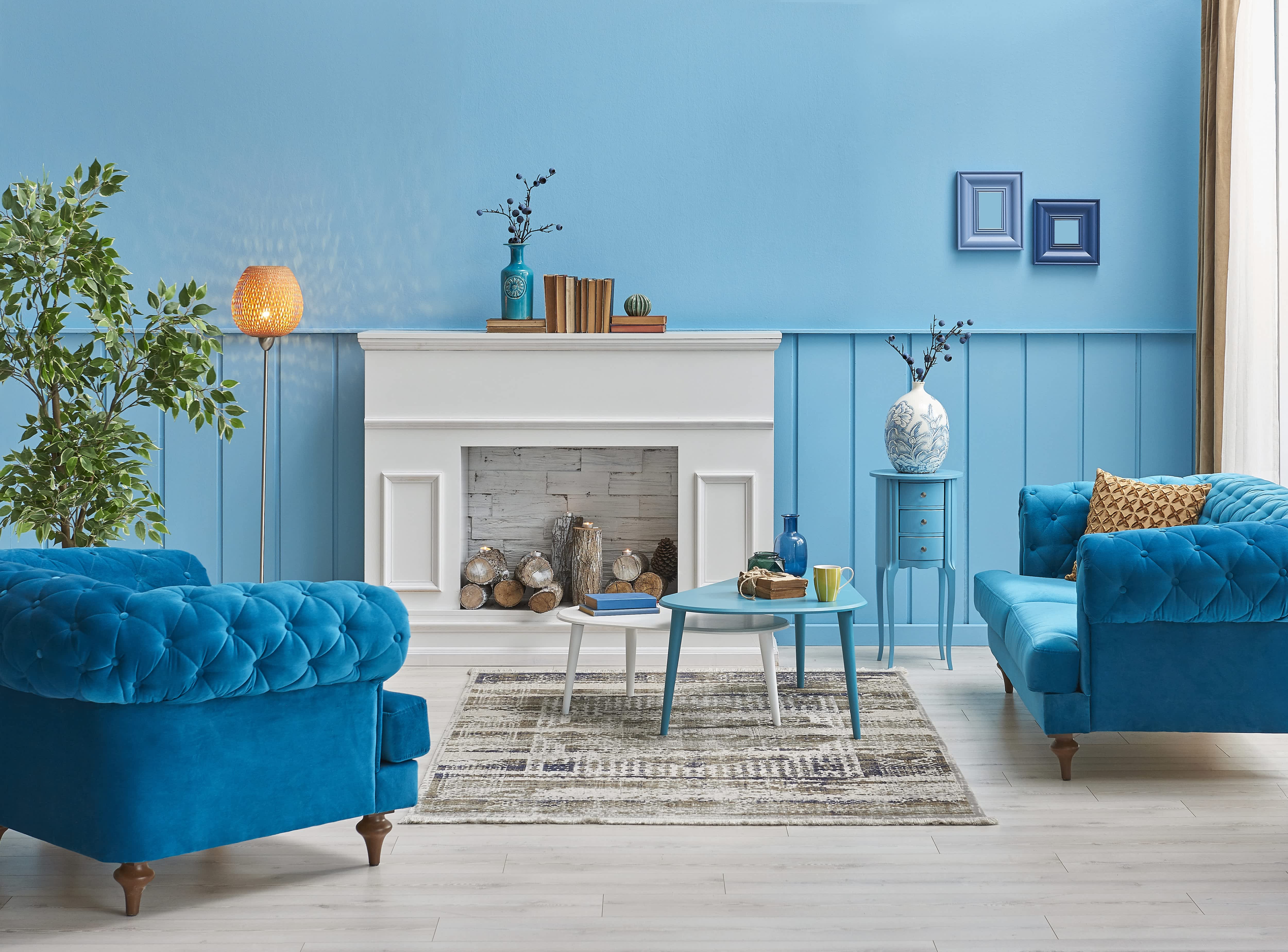White fireplace against blue wall