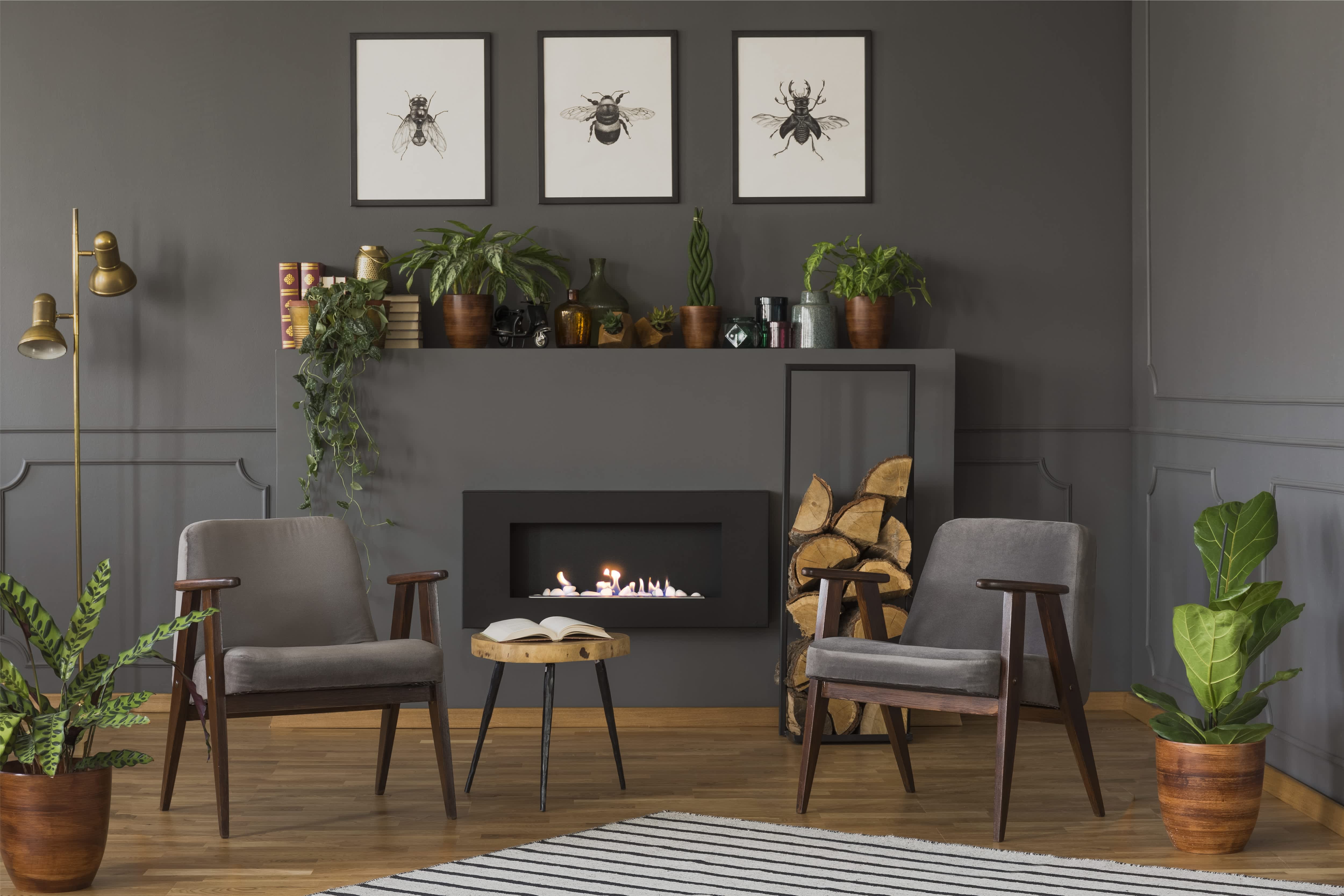 Gray fireplace mantel decorated with plants