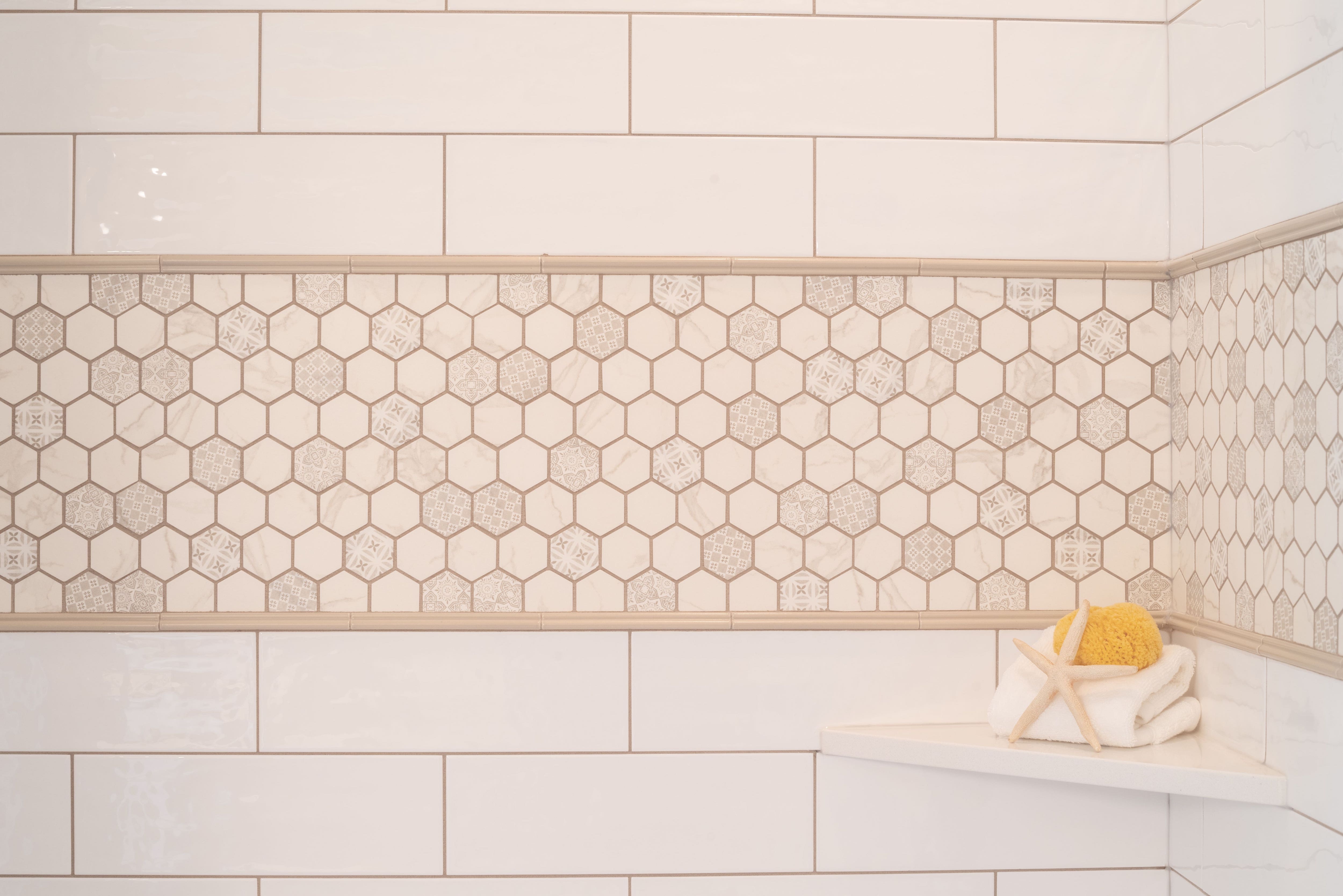Honeycomb accent tiles on shower wall