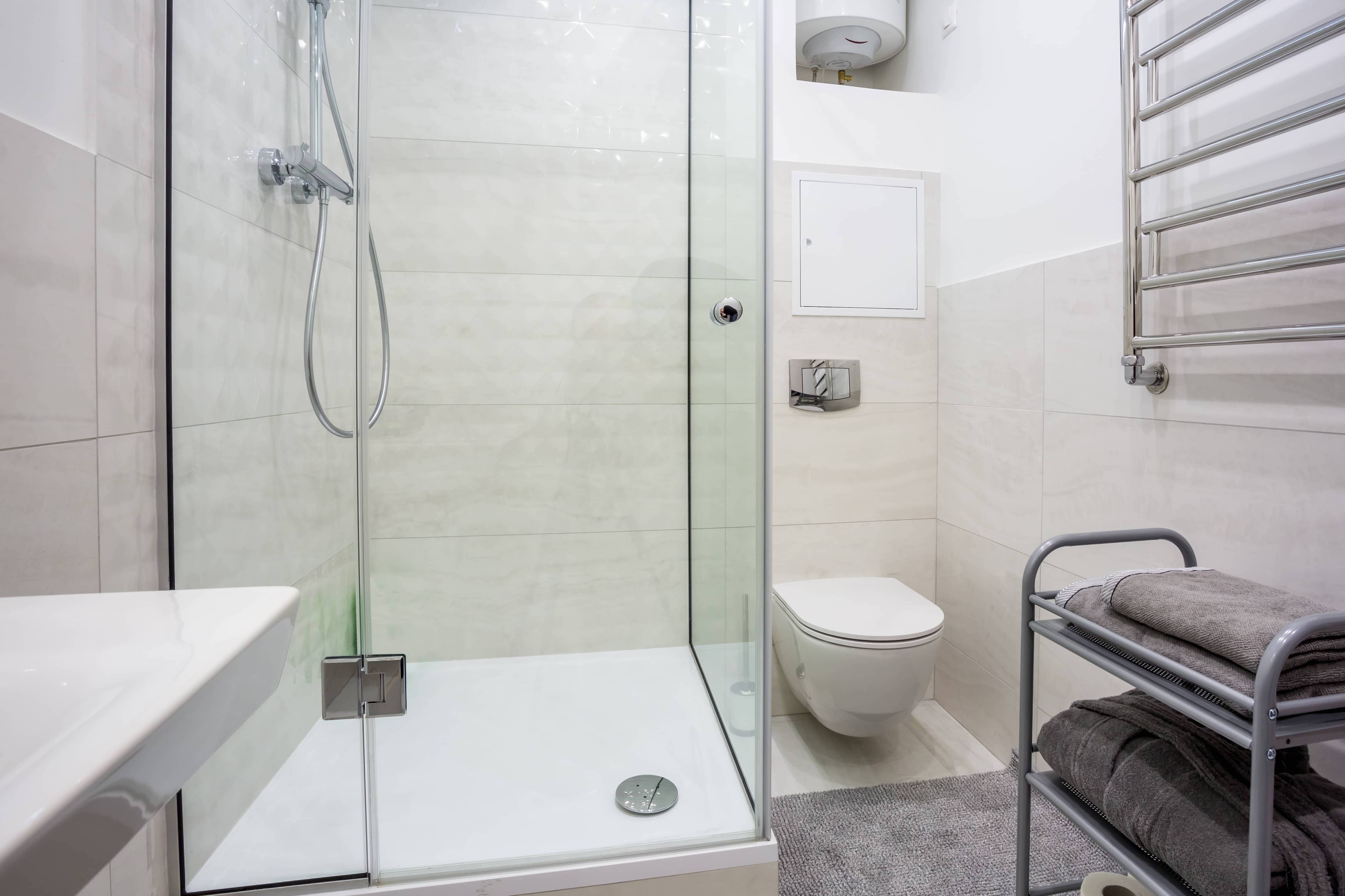 Large tiles in shower and on bathroom walls
