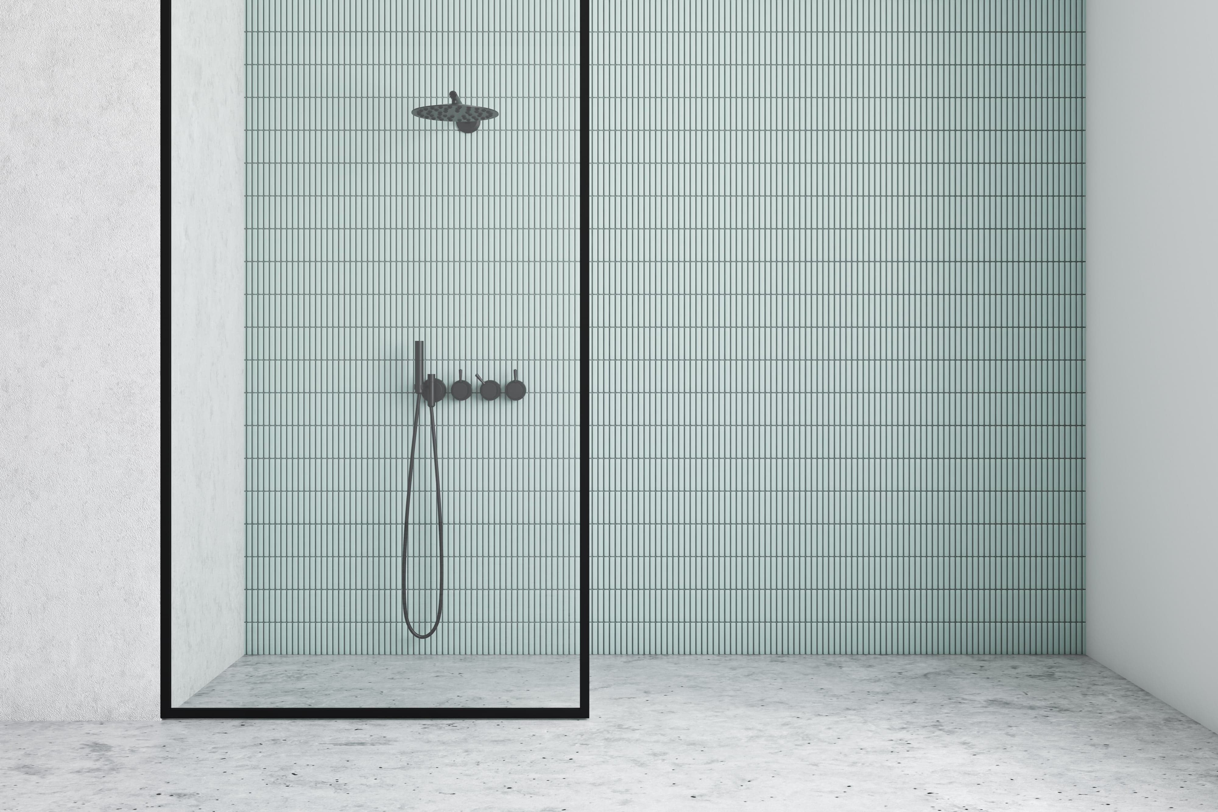 Small blue vertical tiles in bathroom shower