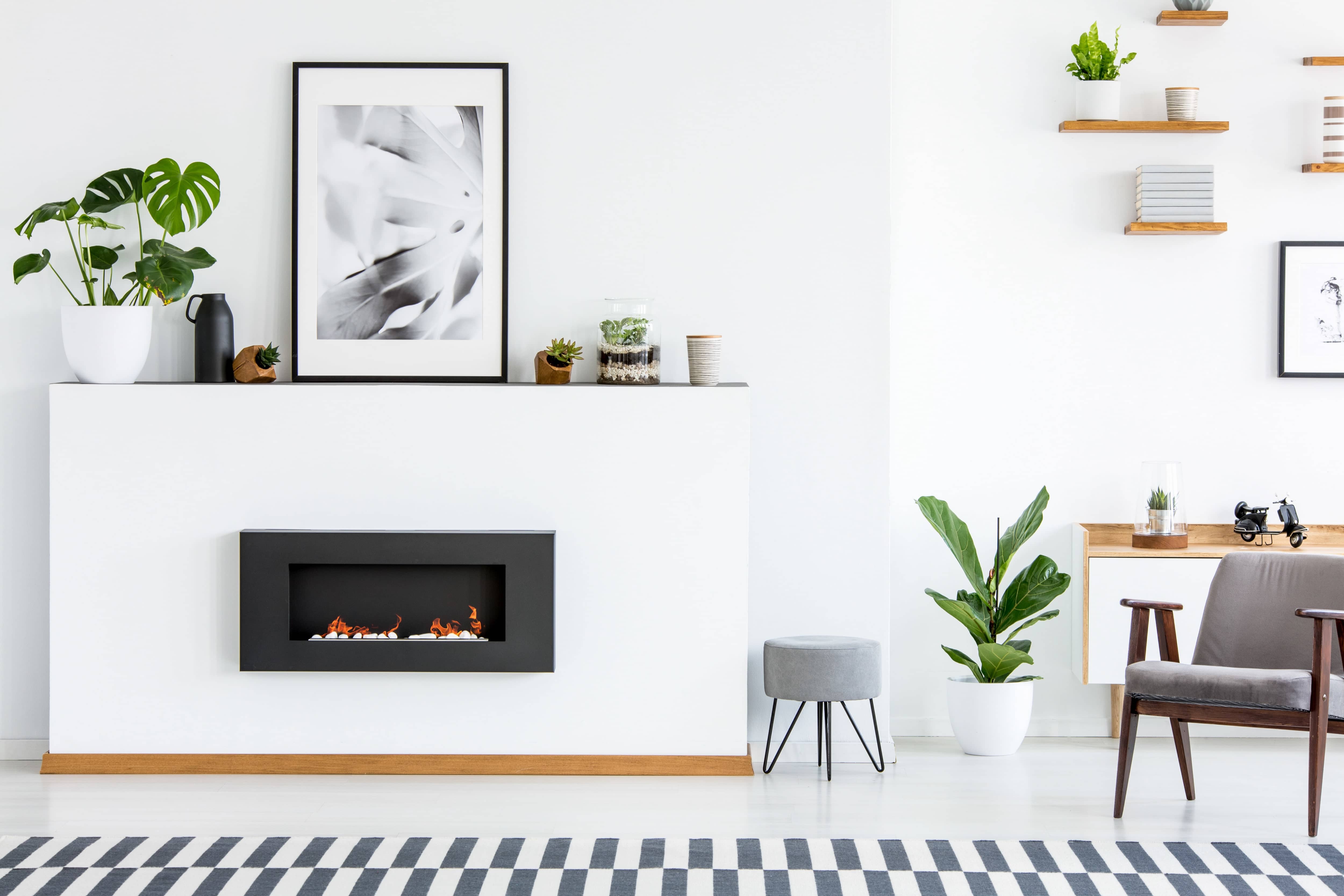White and black fireplace with black and white decor items