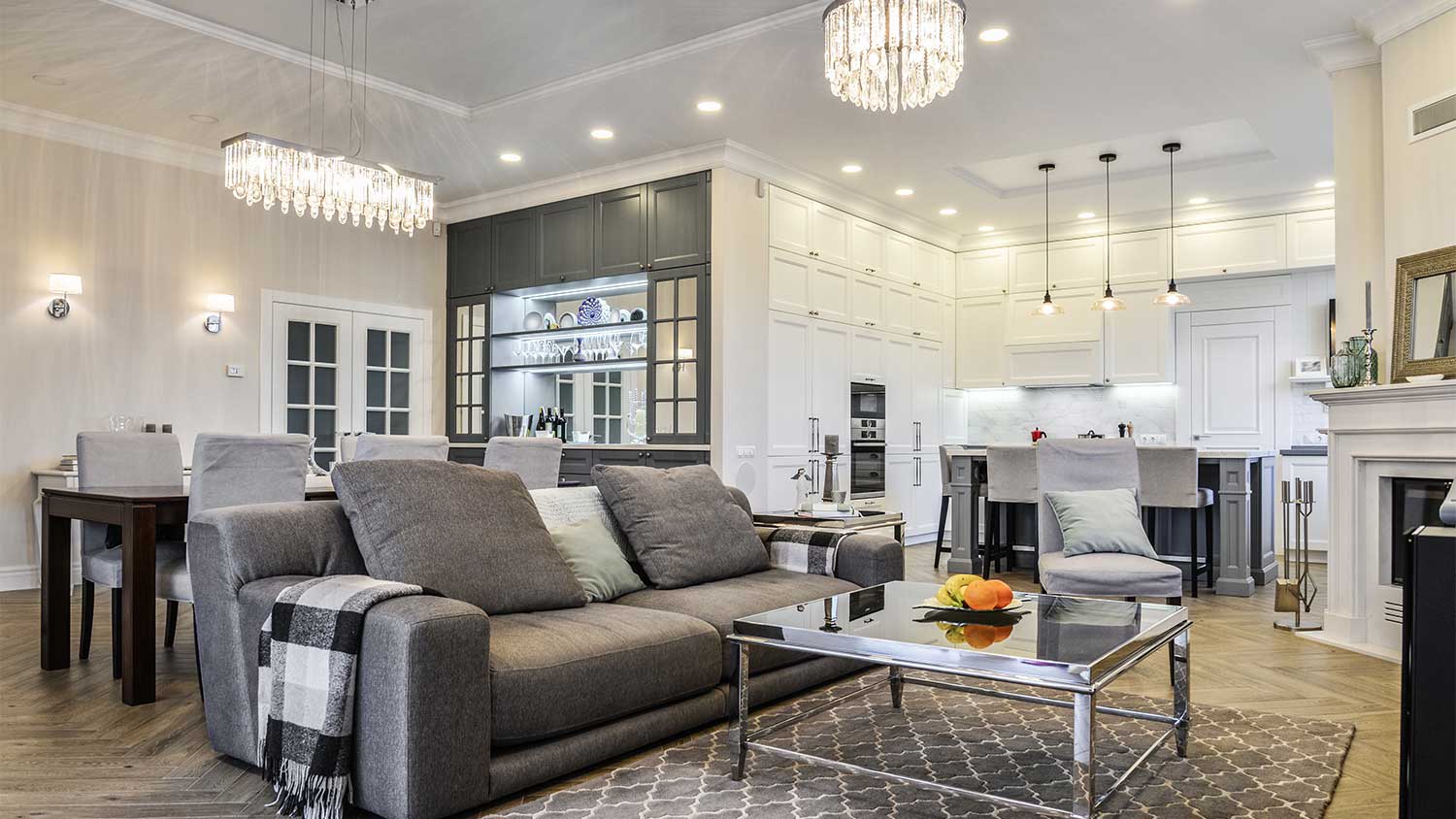 Open concept living room with lights on