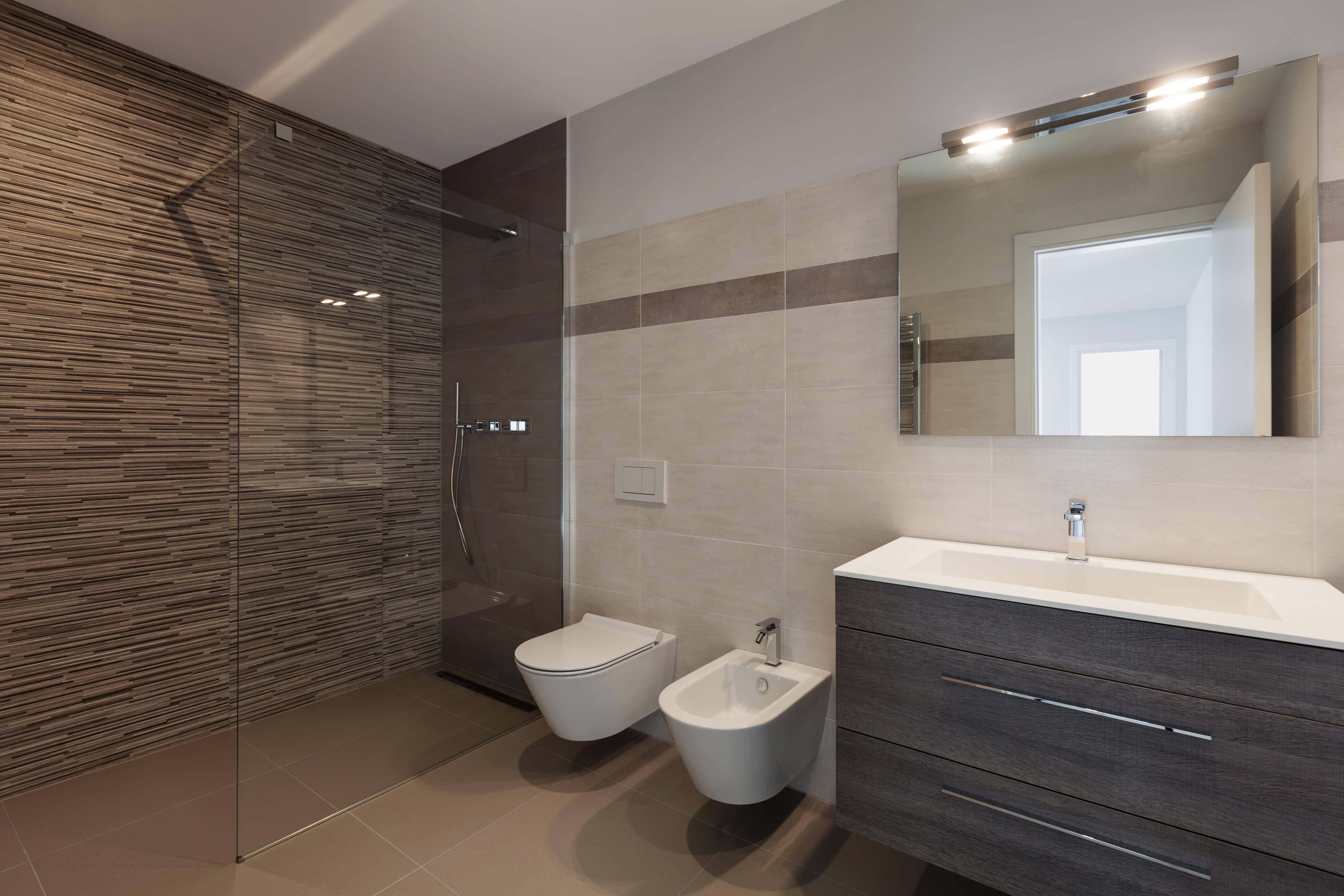 Modern bathroom with dark tiled shower
