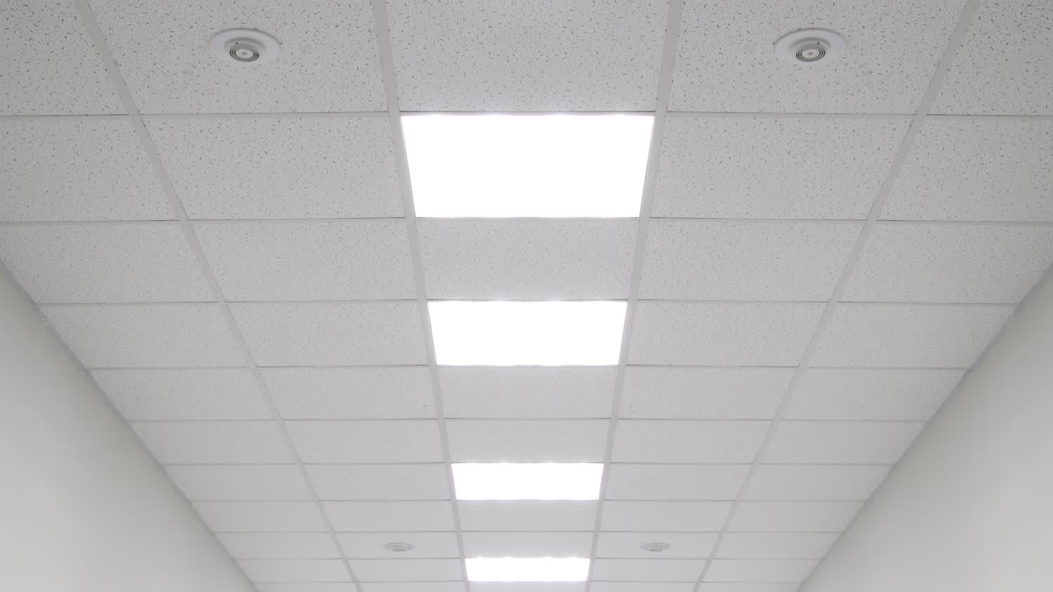 A close up of a white drop ceiling