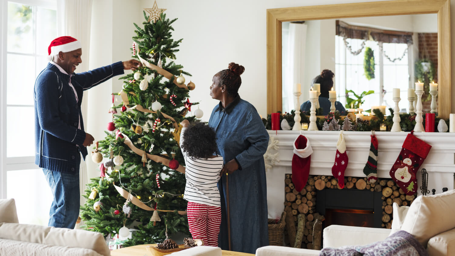 family decorating Christmas tree