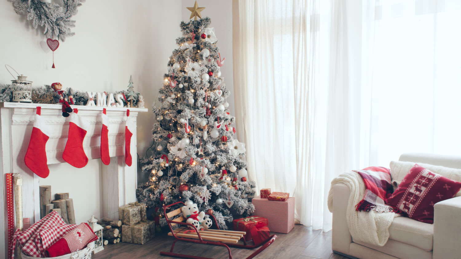Beautiful holiday decorated room with Christmas tree with presents under it