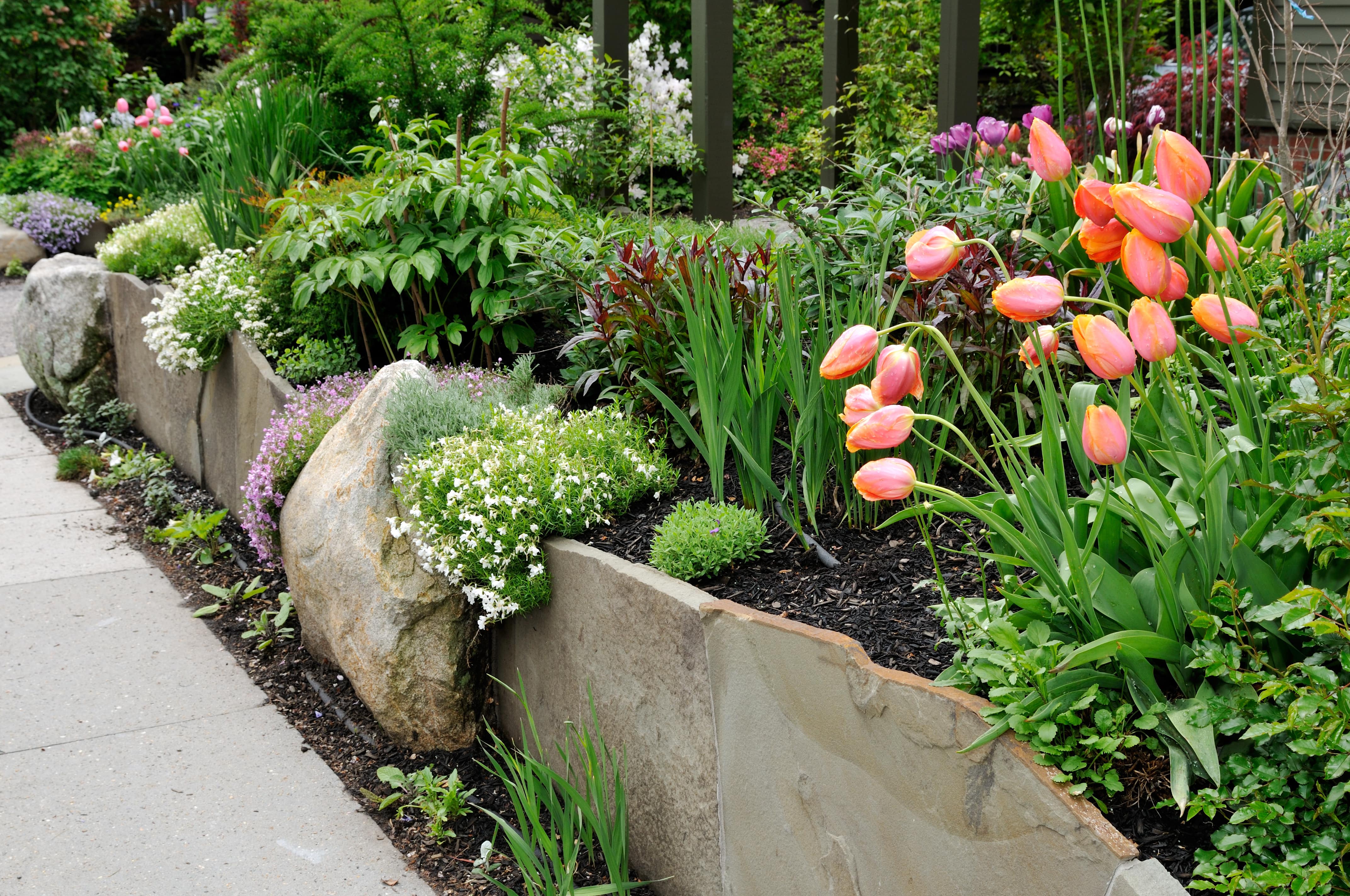 Stone edging in front of flower bed