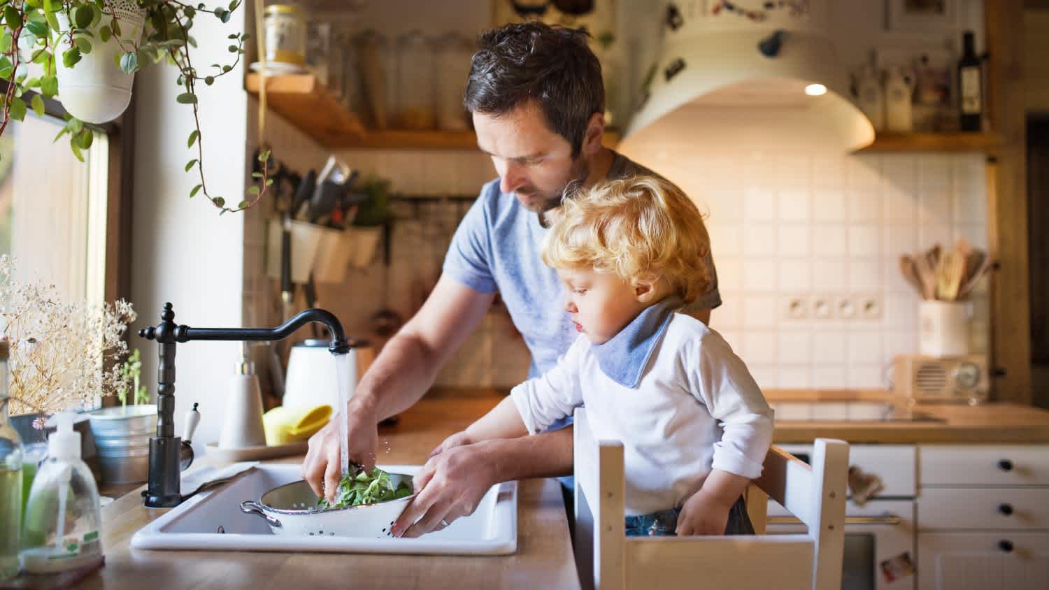 Father with a toddler boy cooking