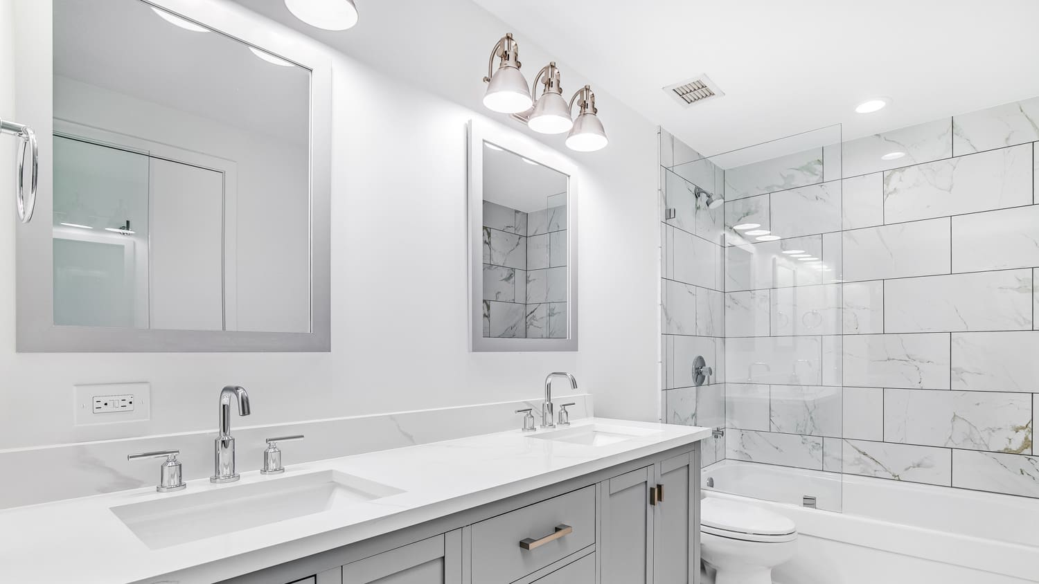 A double sink vanity with halogen lights