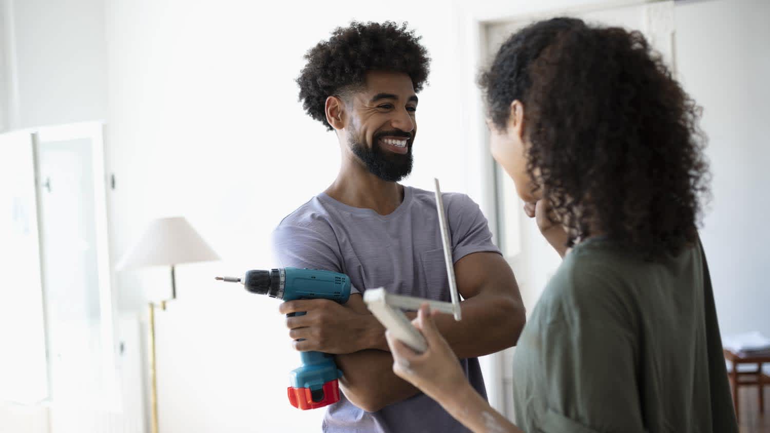 Smiling couple doing DIY project