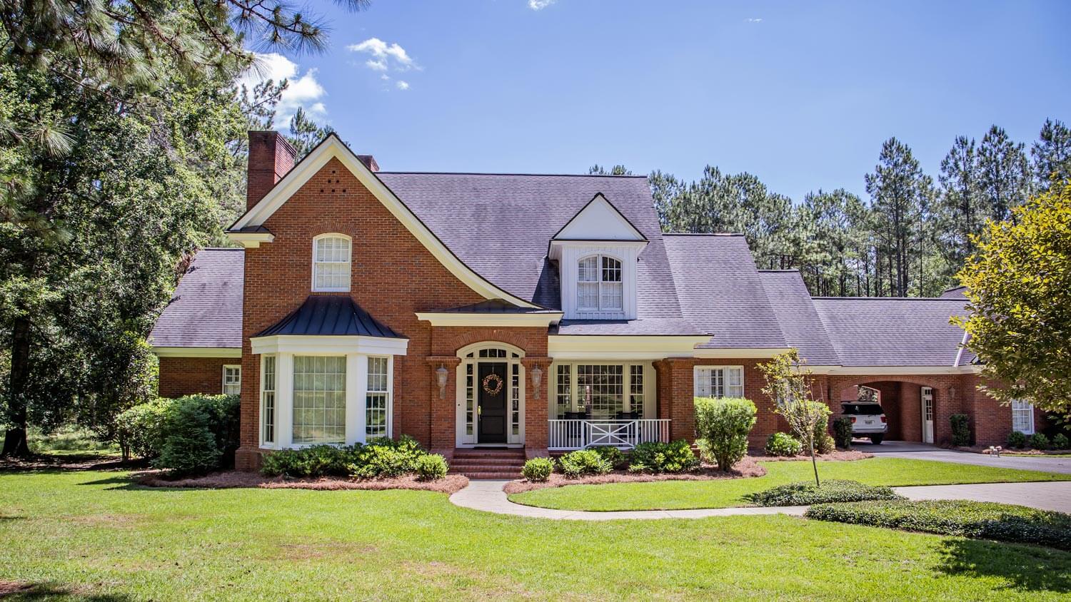 The exterior of an exposed brick house