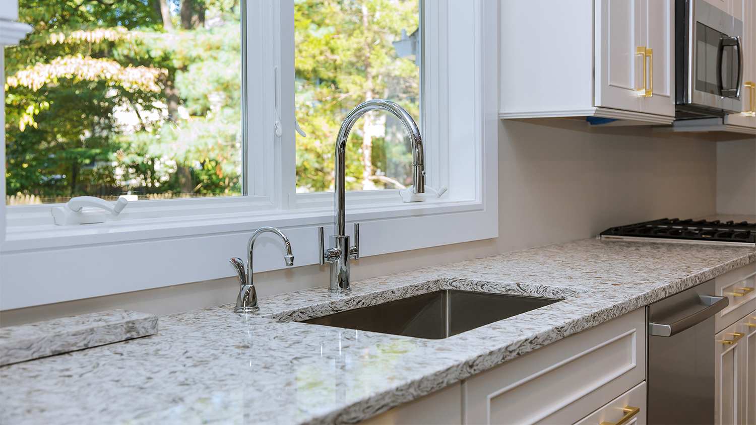 white kitchen with marble effect countertop