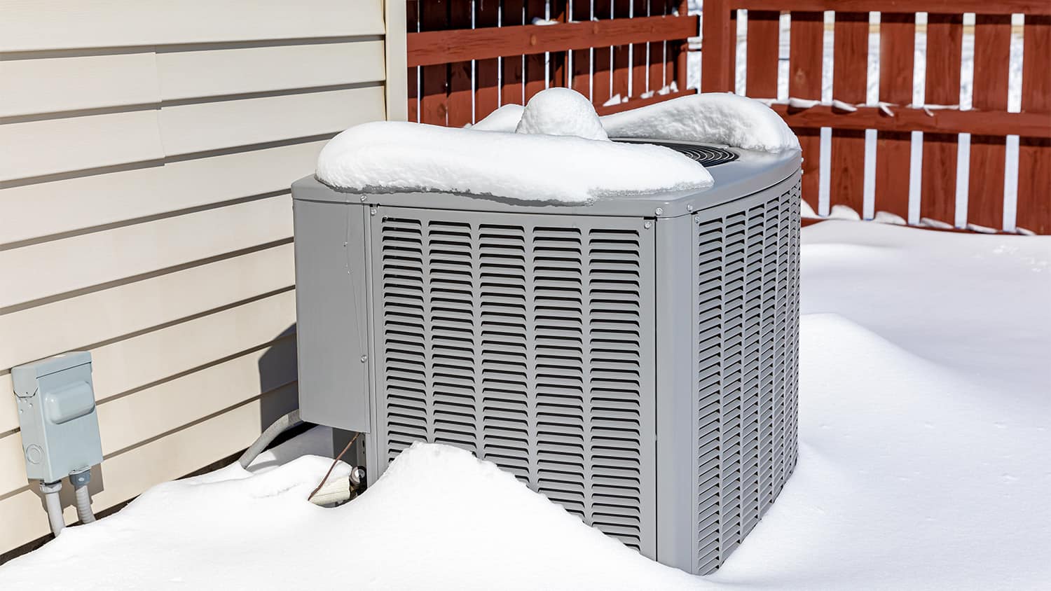 outdoor ac unit in the winter