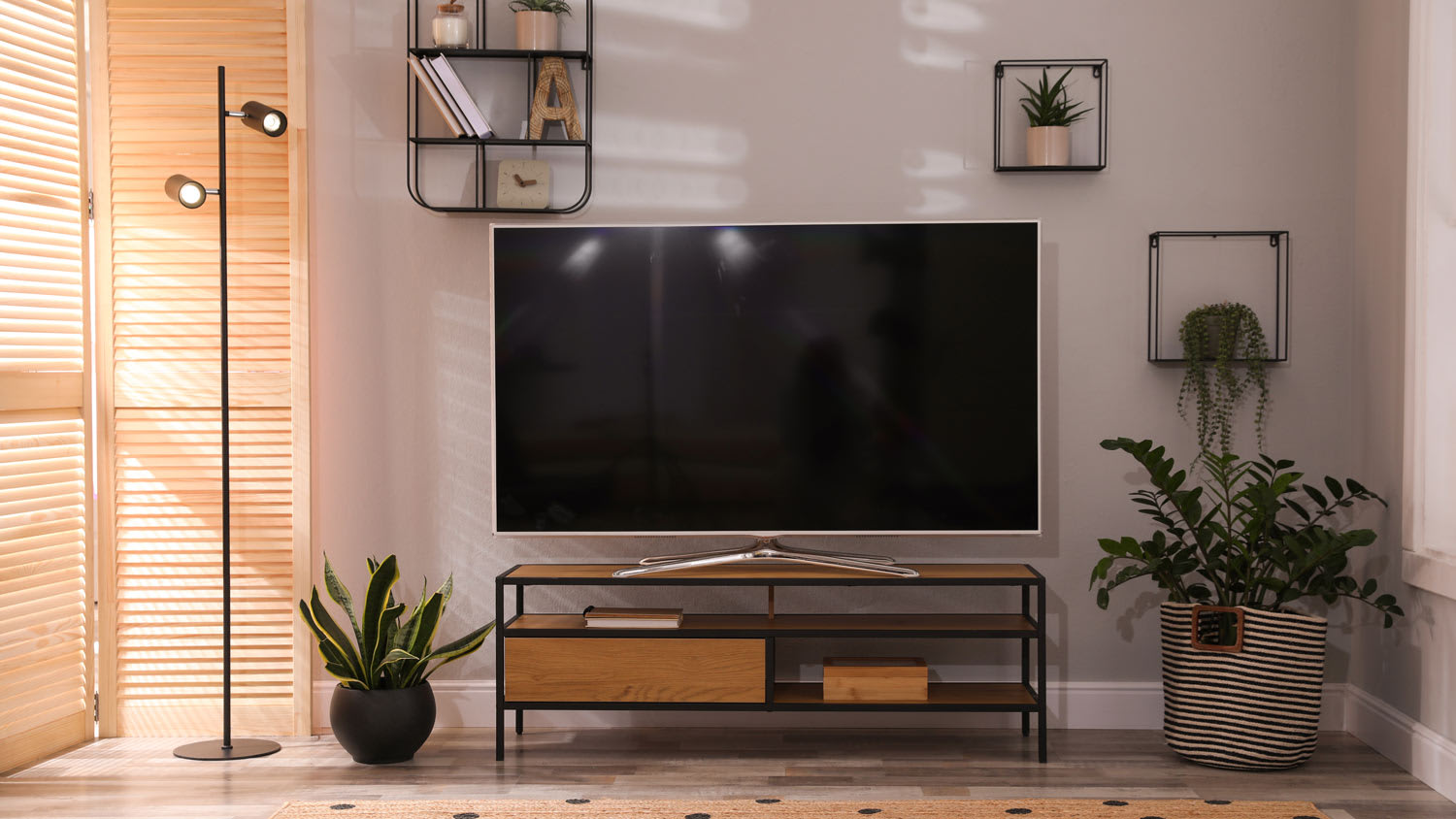 A TV unit with floating shelves