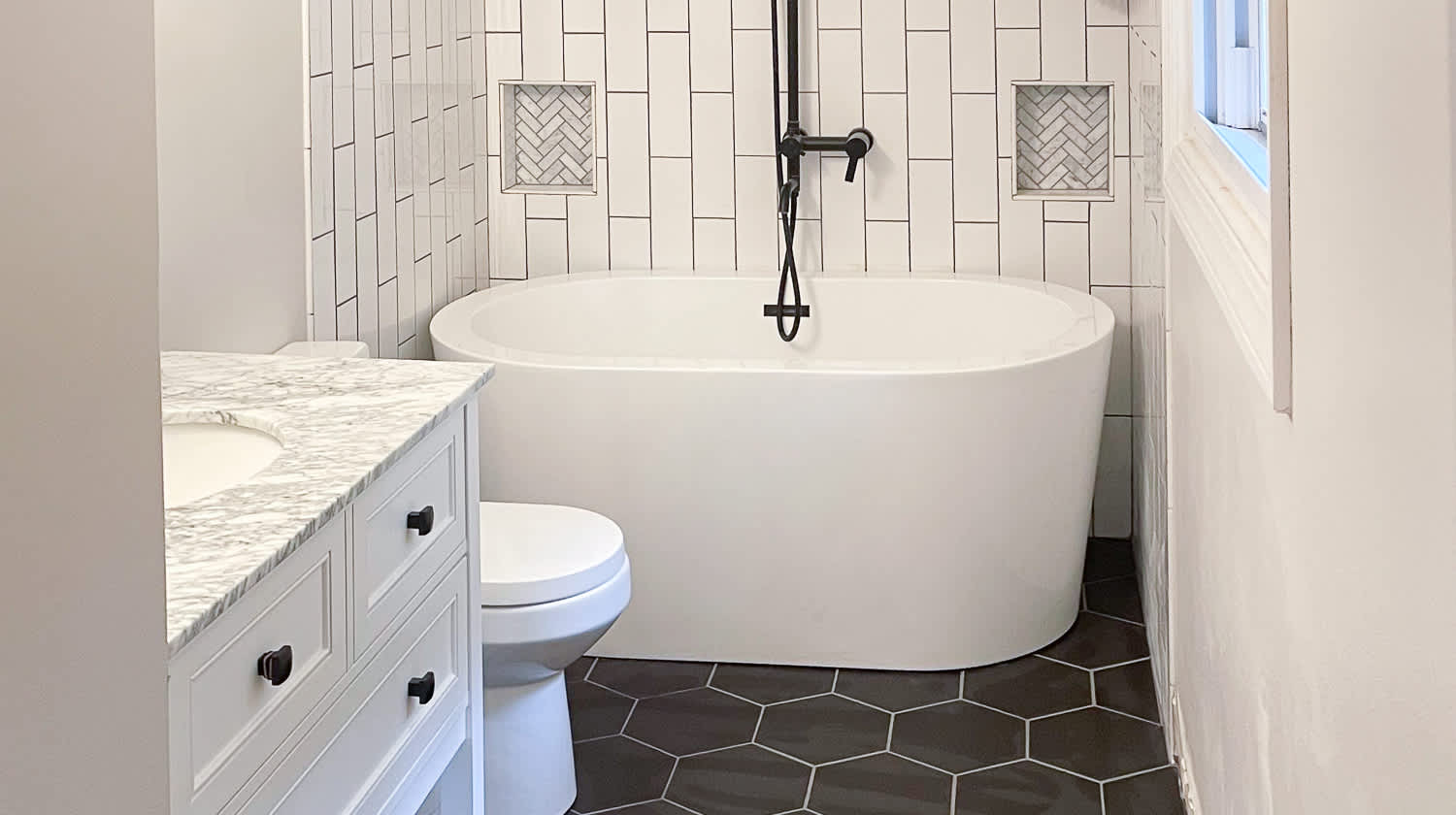White bathroom with black floor