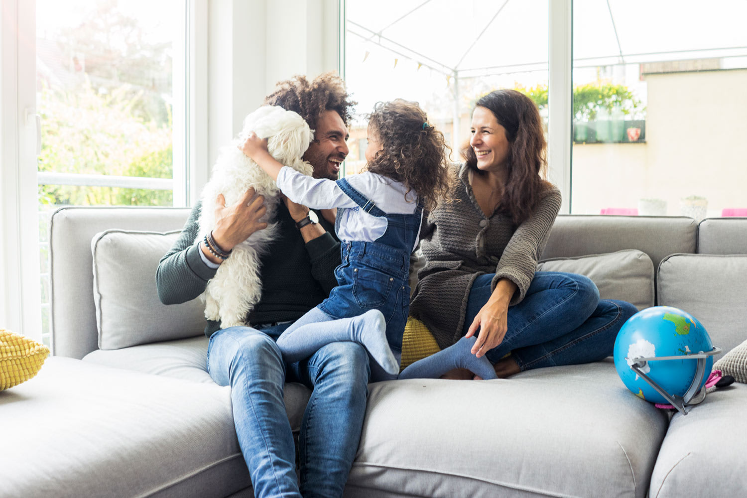 Family sitting on the couch together