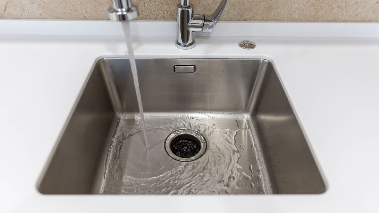 running water sink garbage disposal
