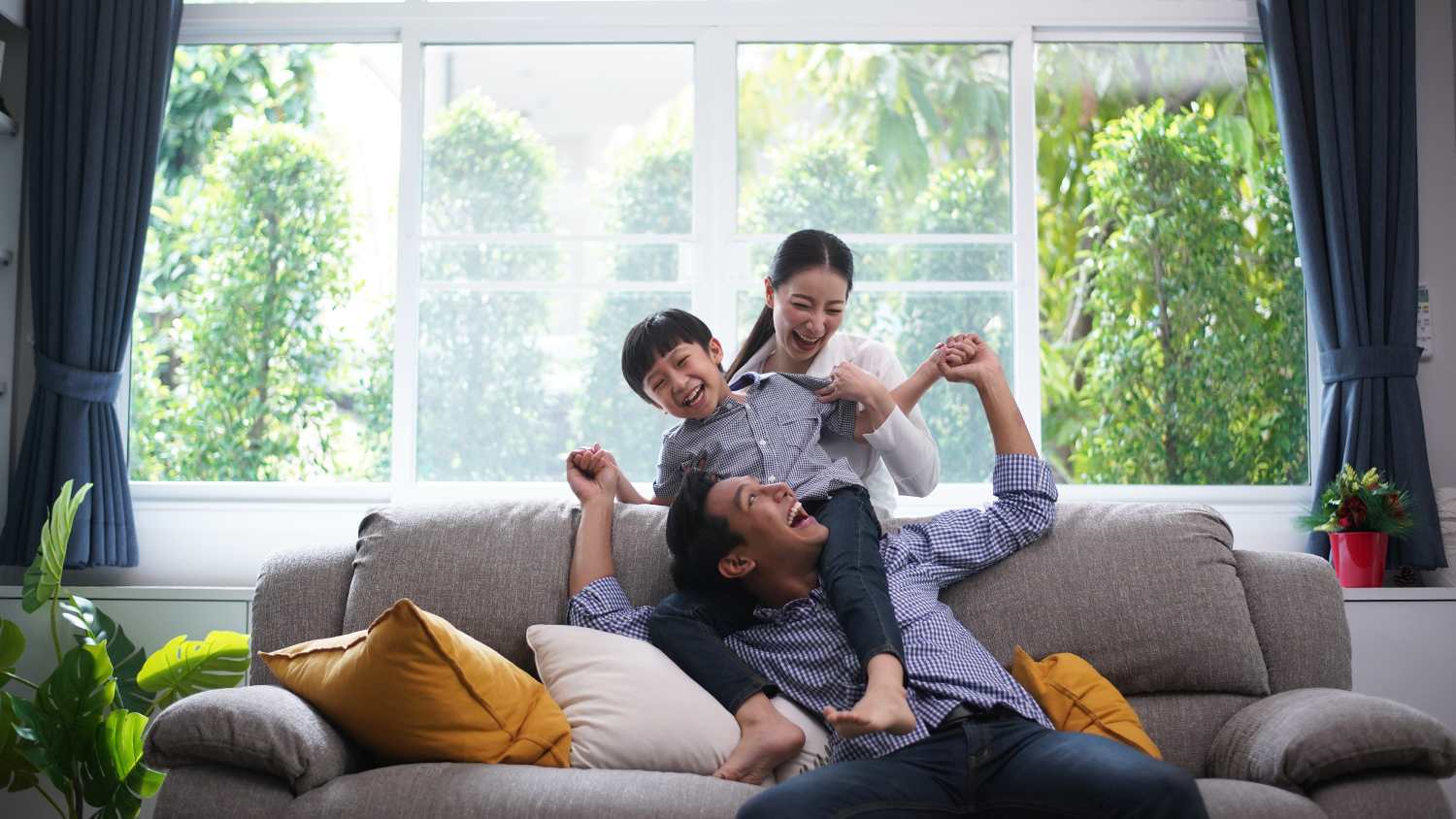 family relaxing at home watching tv