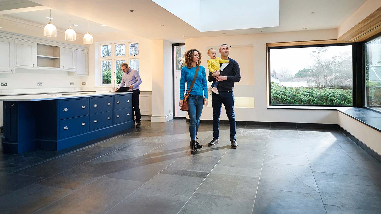 family looking around big spacious house