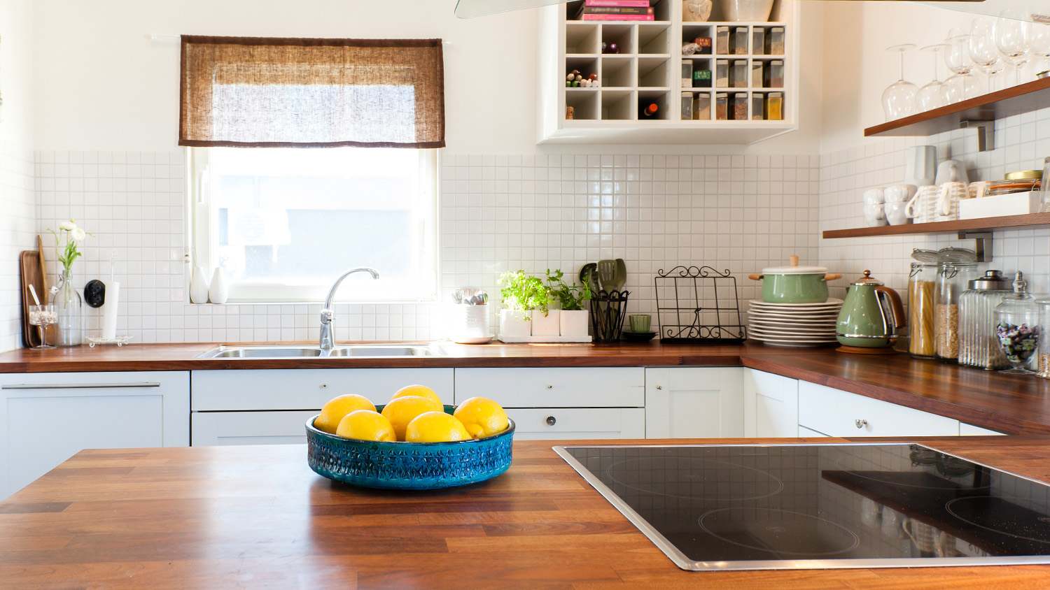 clean organized kitchen with wood countertop