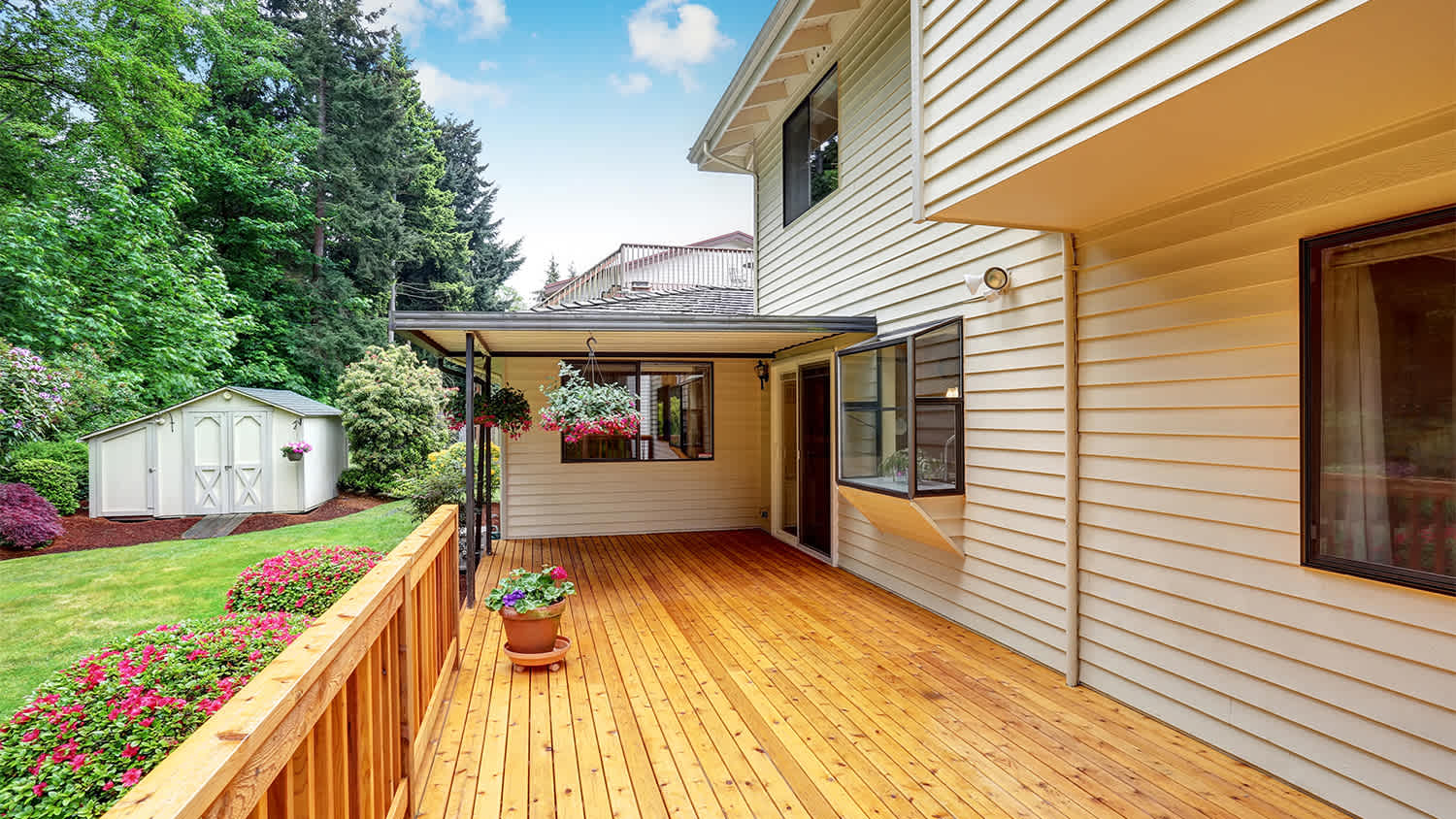 wooden walkout deck with flowers