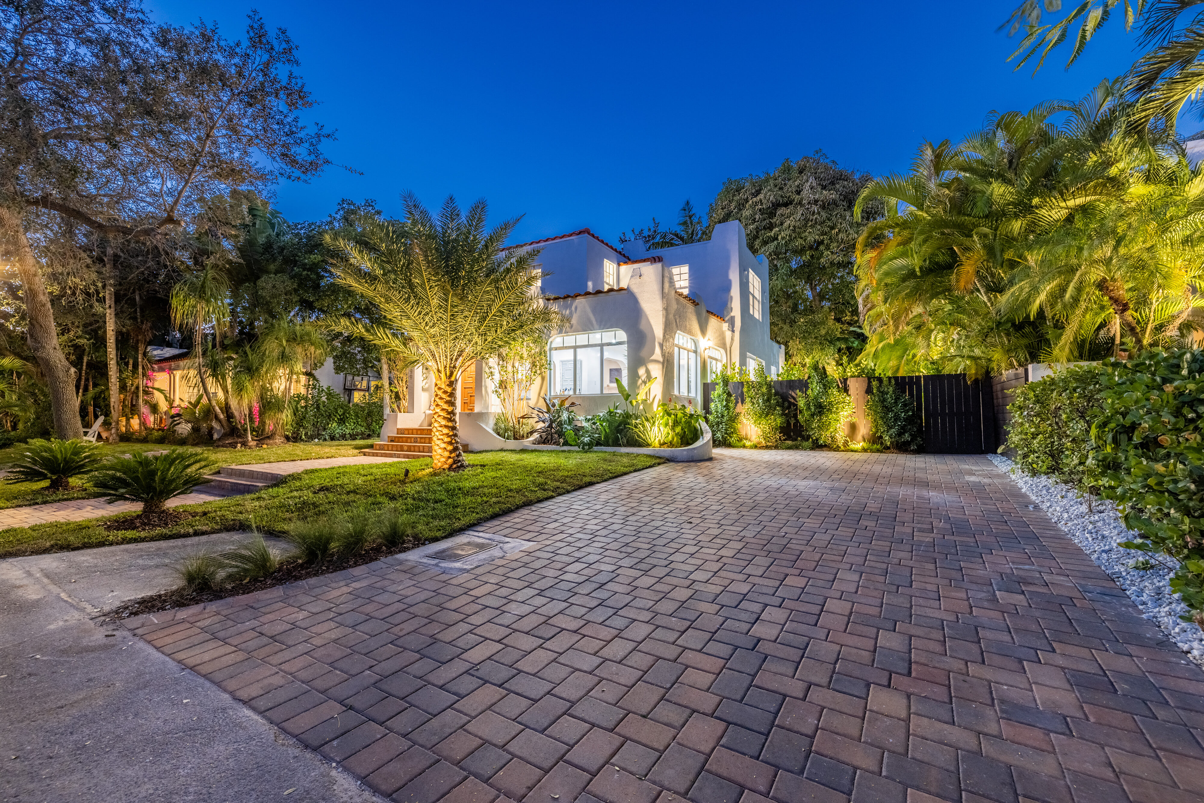 paver replaces concrete driveway