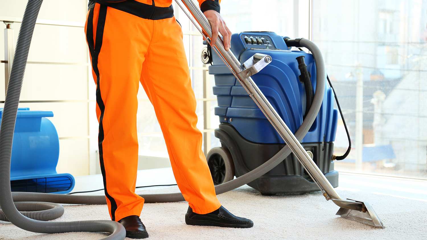 professional carpet cleaner using portable cleaner