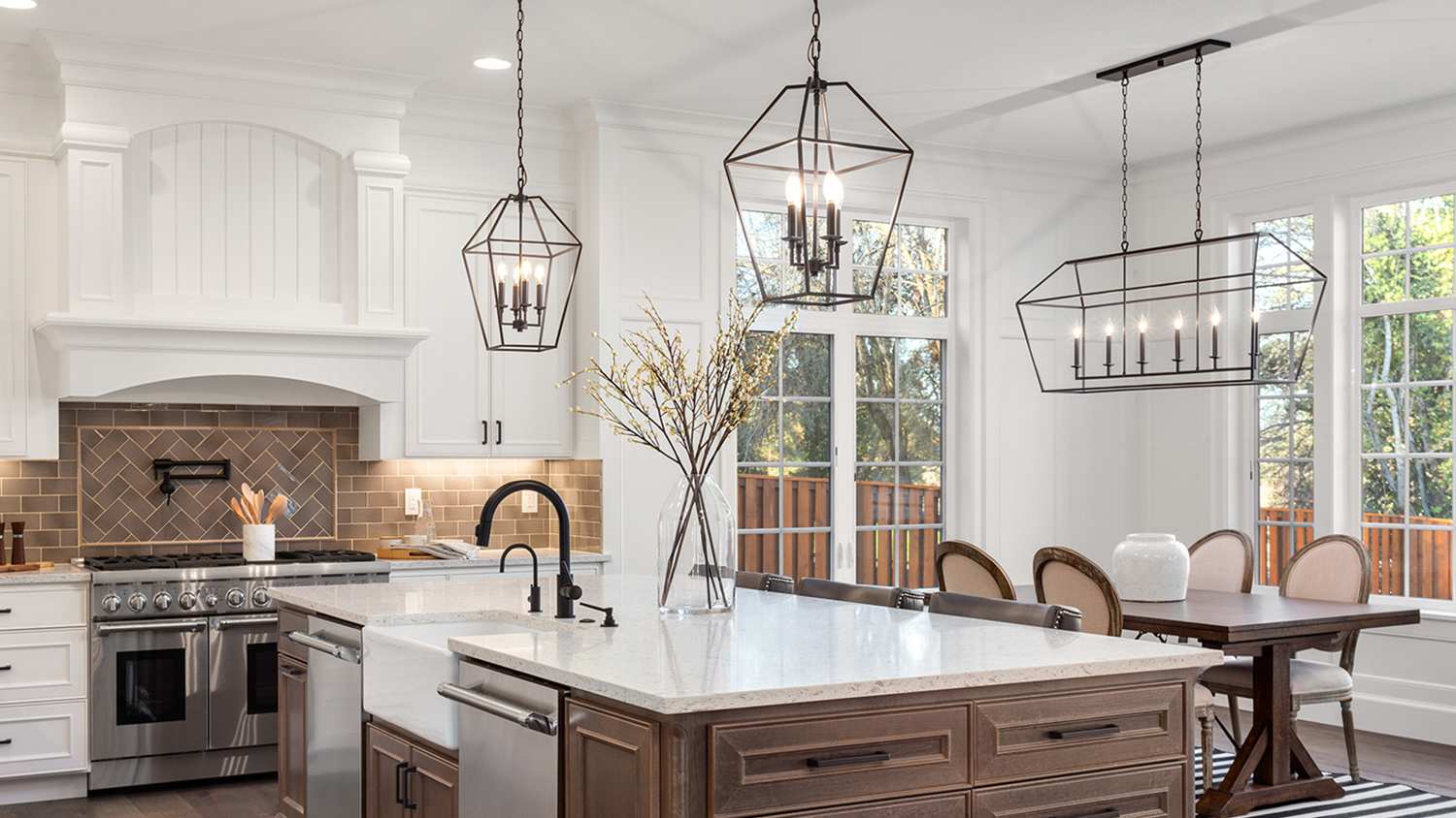 luxury white kitchen with glass light fixtures