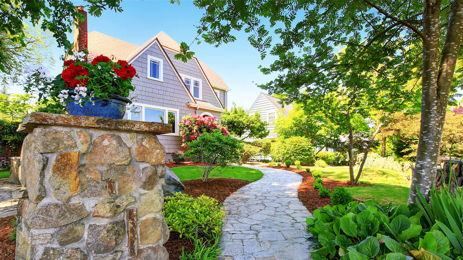 American craftsman house exterior. Nice landscape design around.