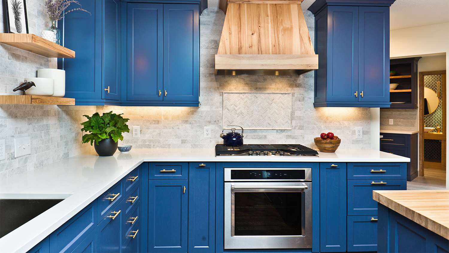 Contemporary kitchen with blue cabinets