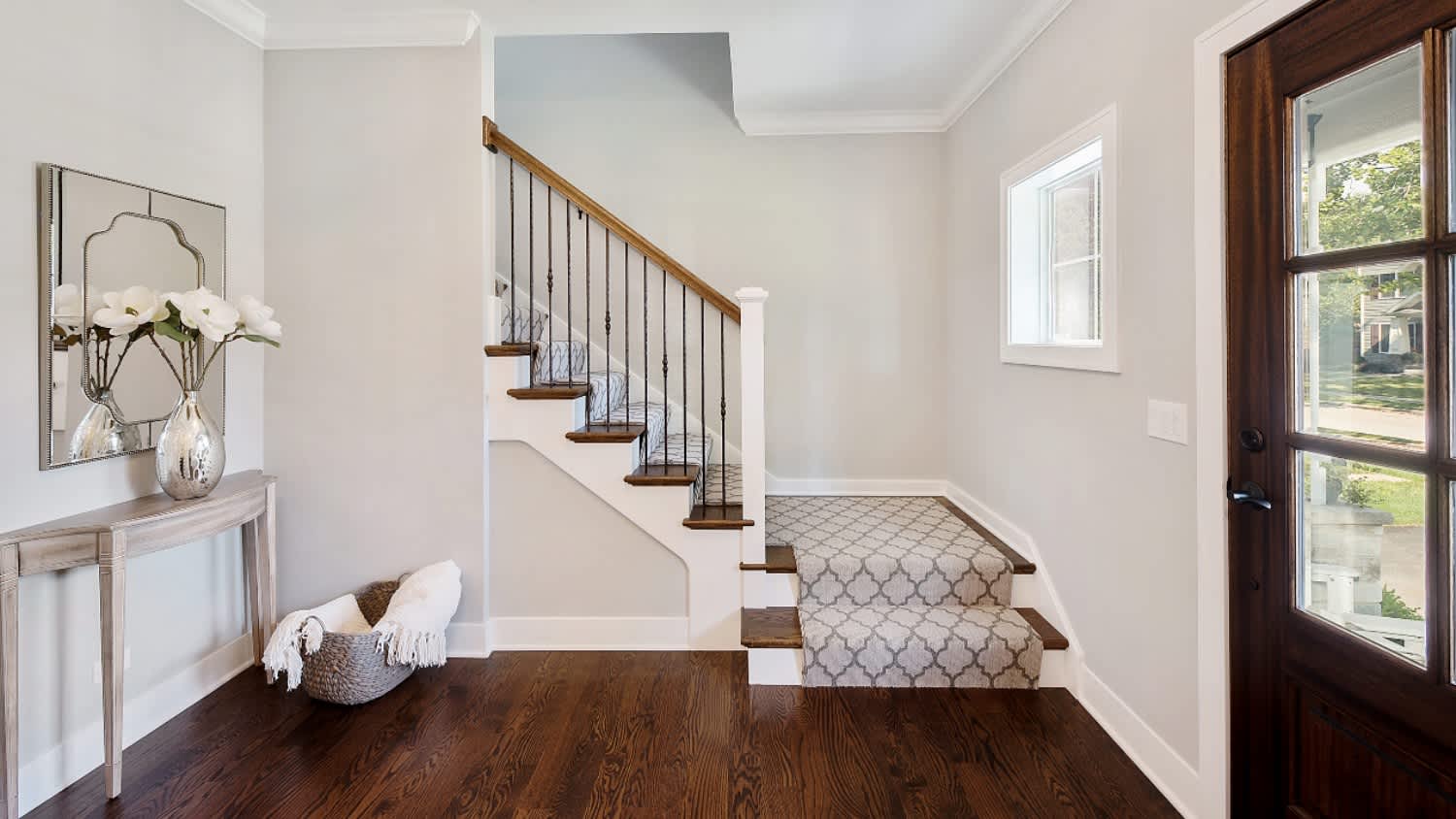front entryway with stairs and hardwood floors