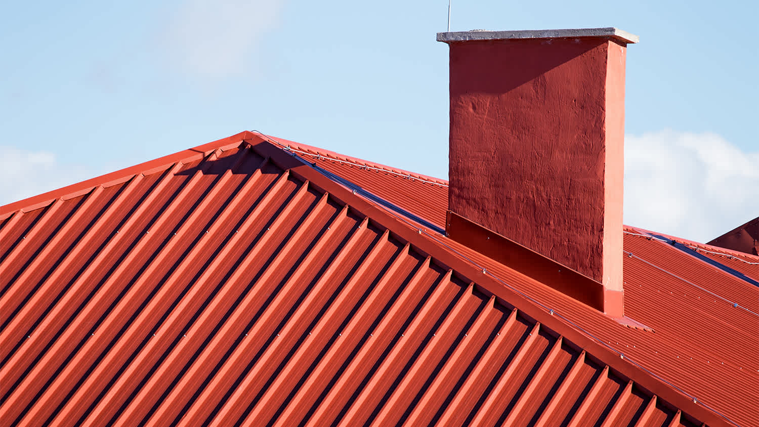 red metal roof and chimney