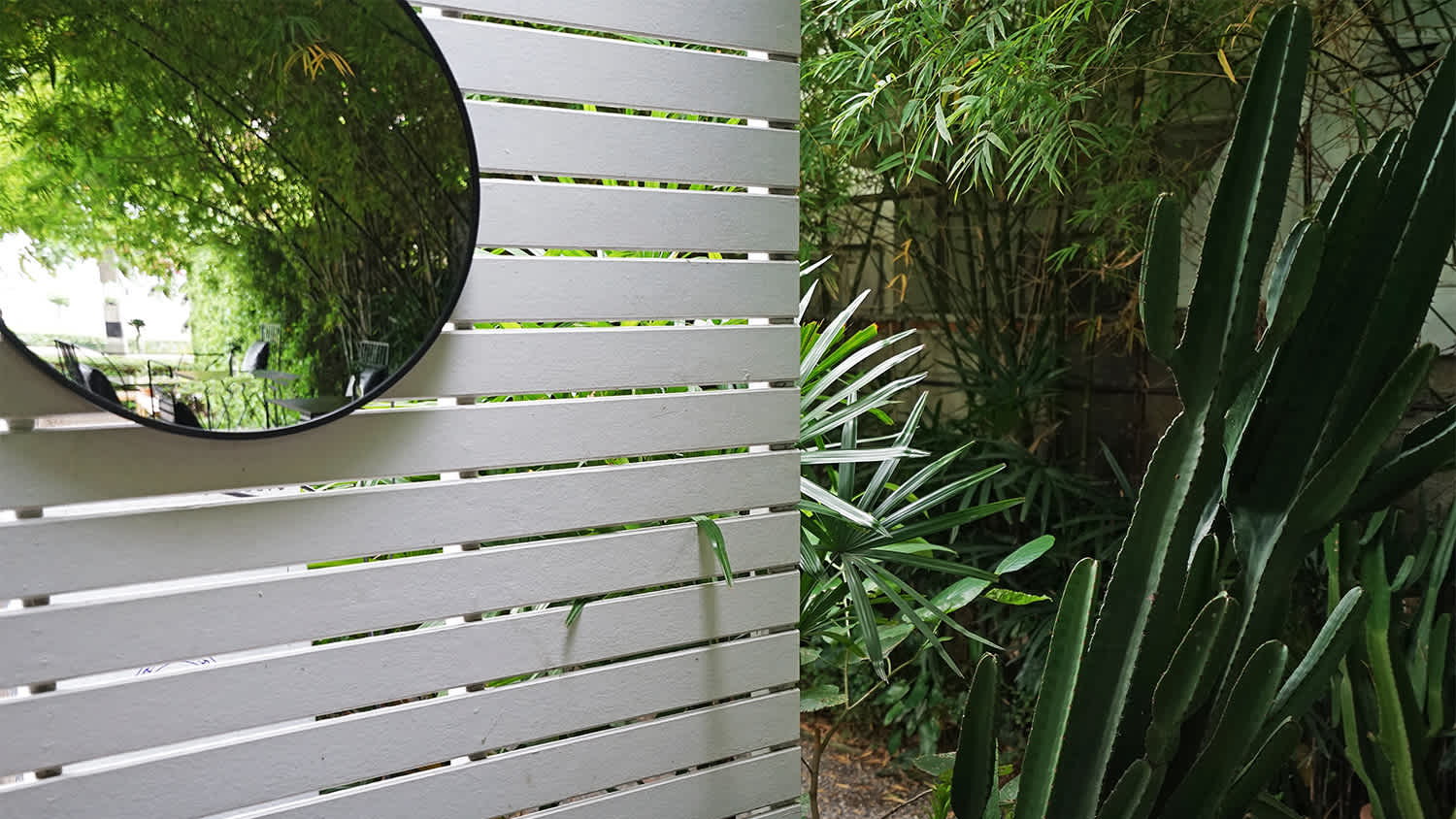 grey panel with mirror in patio