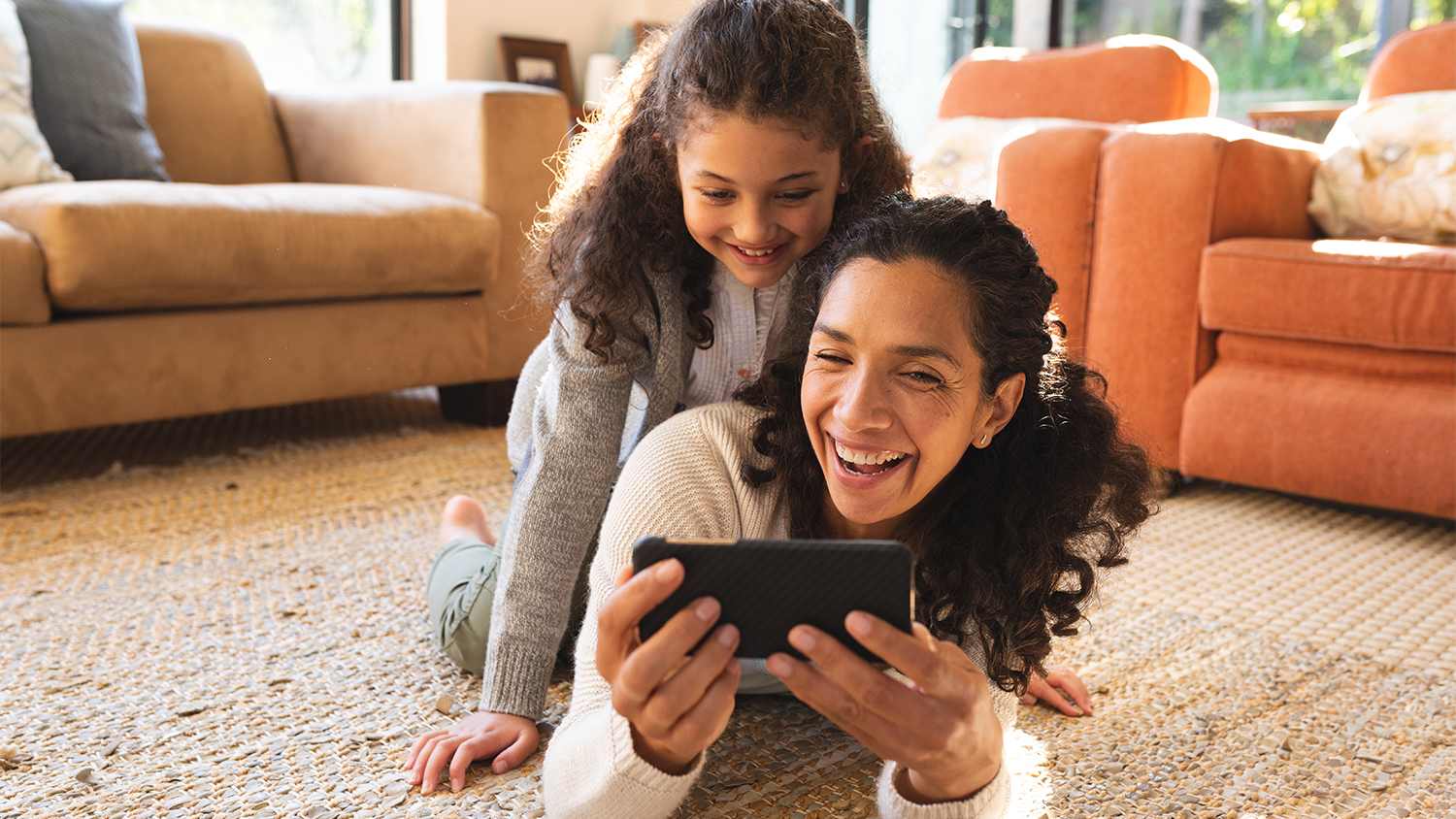 mother and daughter hanging out on the floor