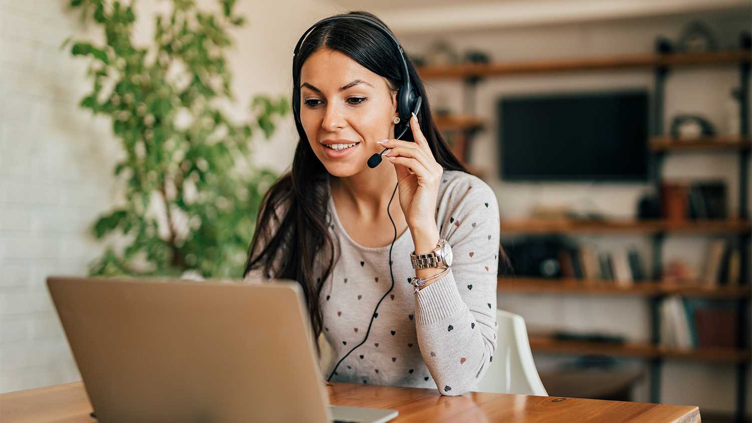 Woman using headset for at home office call