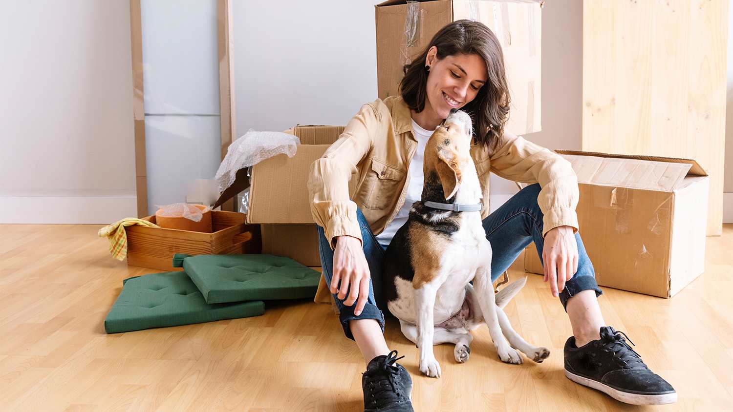 woman moving into new apartment with dog