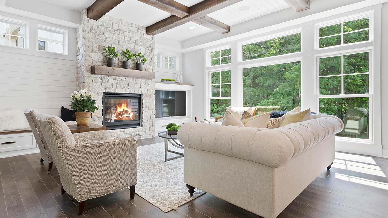 A living room with a stone fireplace