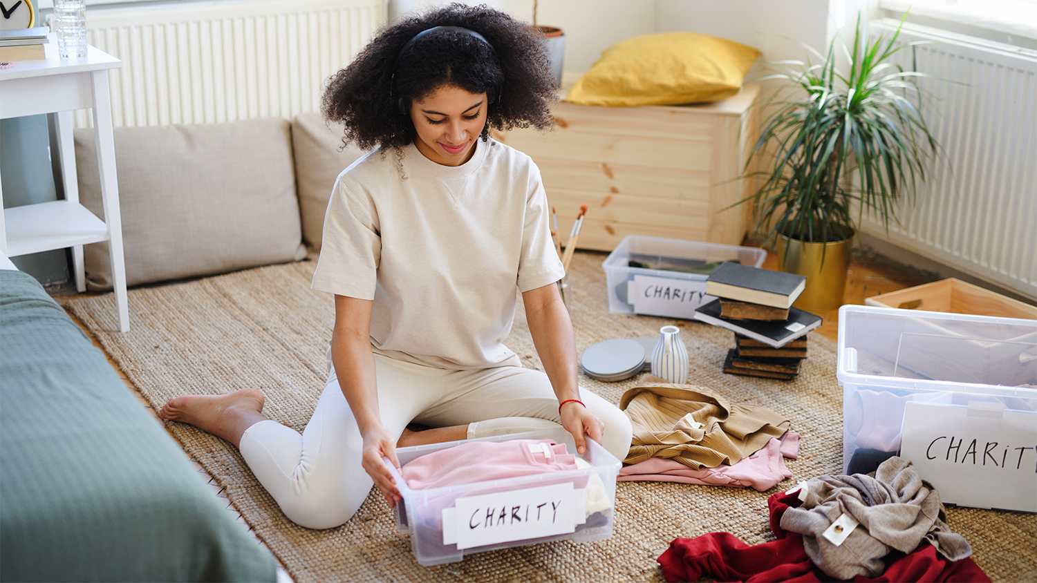 woman sorting out clothes to donate