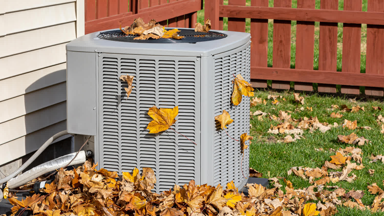 hvac with fall leaves around it