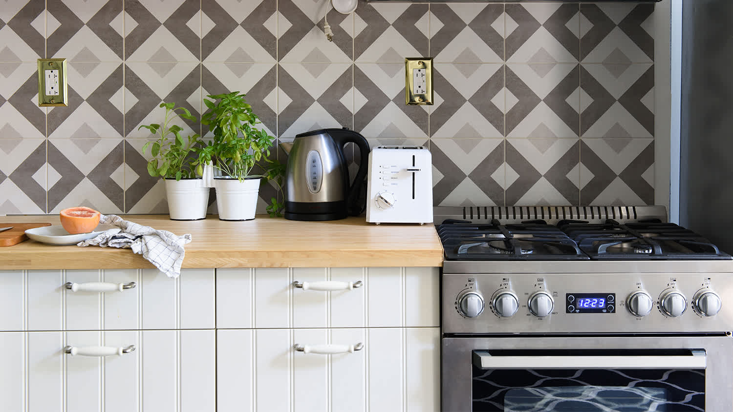 kitchen counter with appliances unplugged from outlet