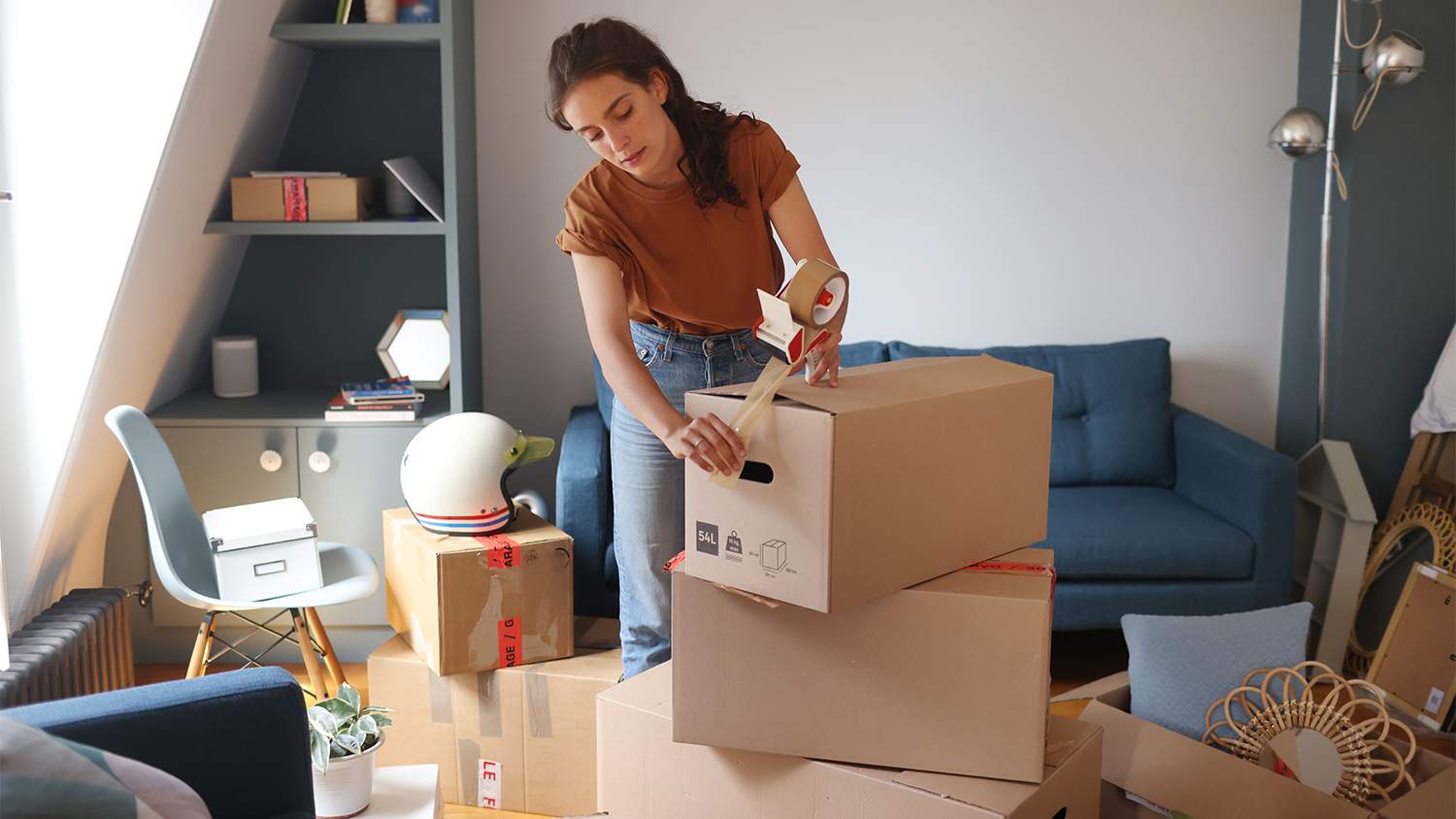 woman packing boxes for new apartment