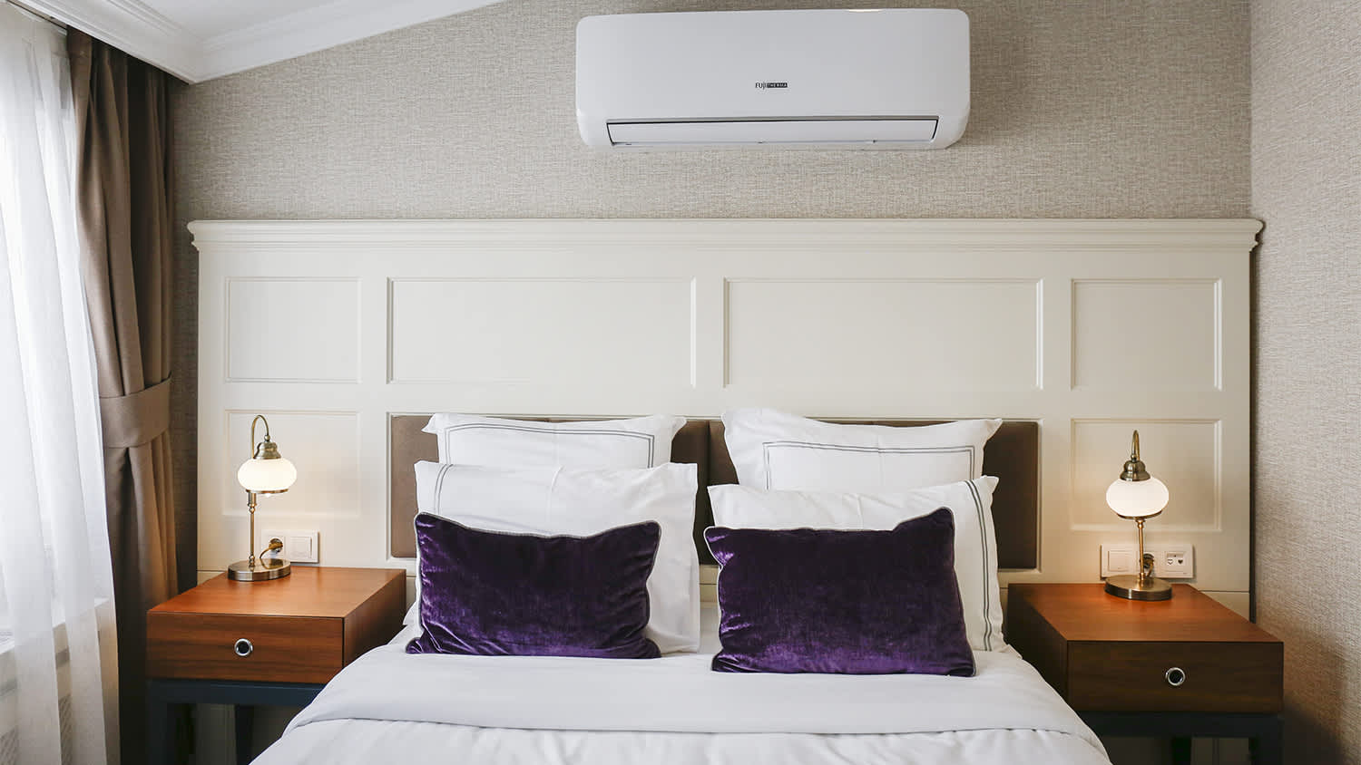 neat bedroom with ac unit