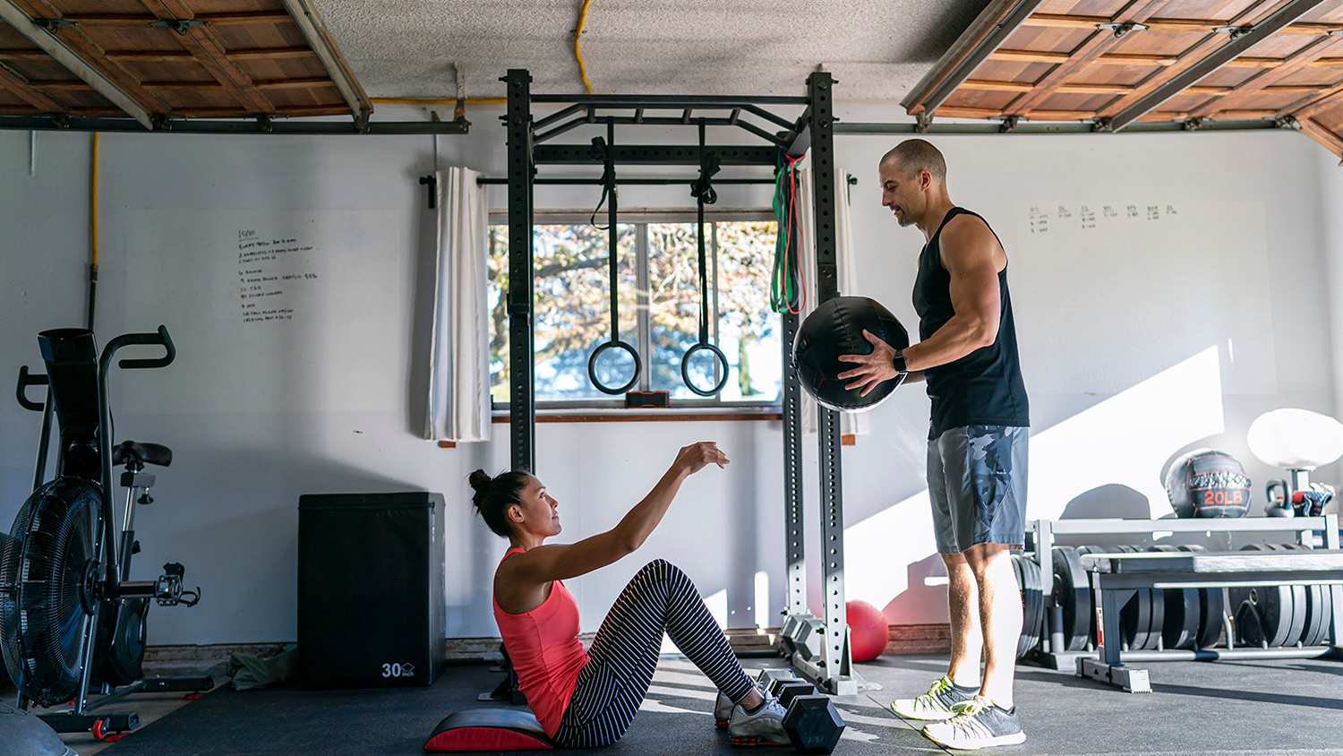 woman exercising in home garage gym