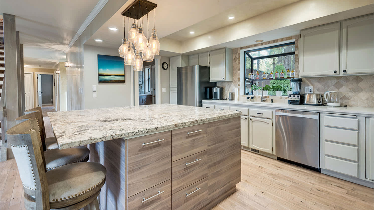 grey kitchen with distressed hardwood floors