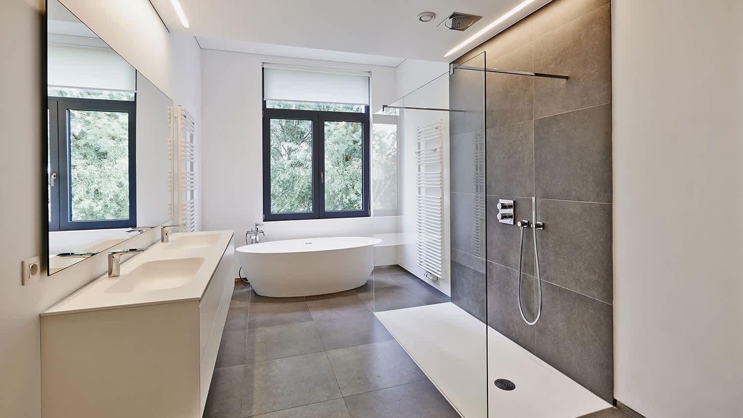 beige and white wet room with curbless shower