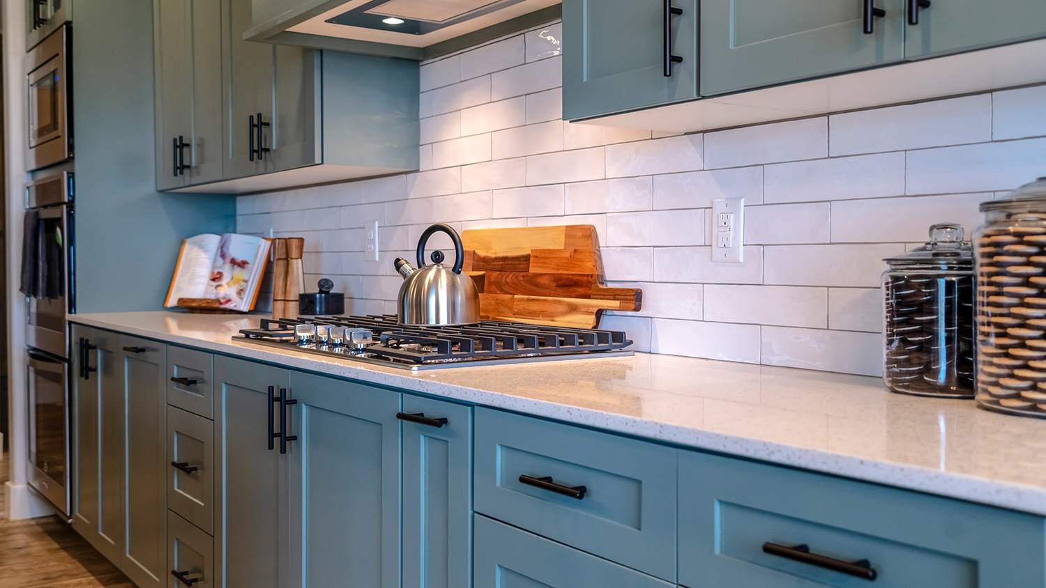 blue kitchen cabinets with matching hardware