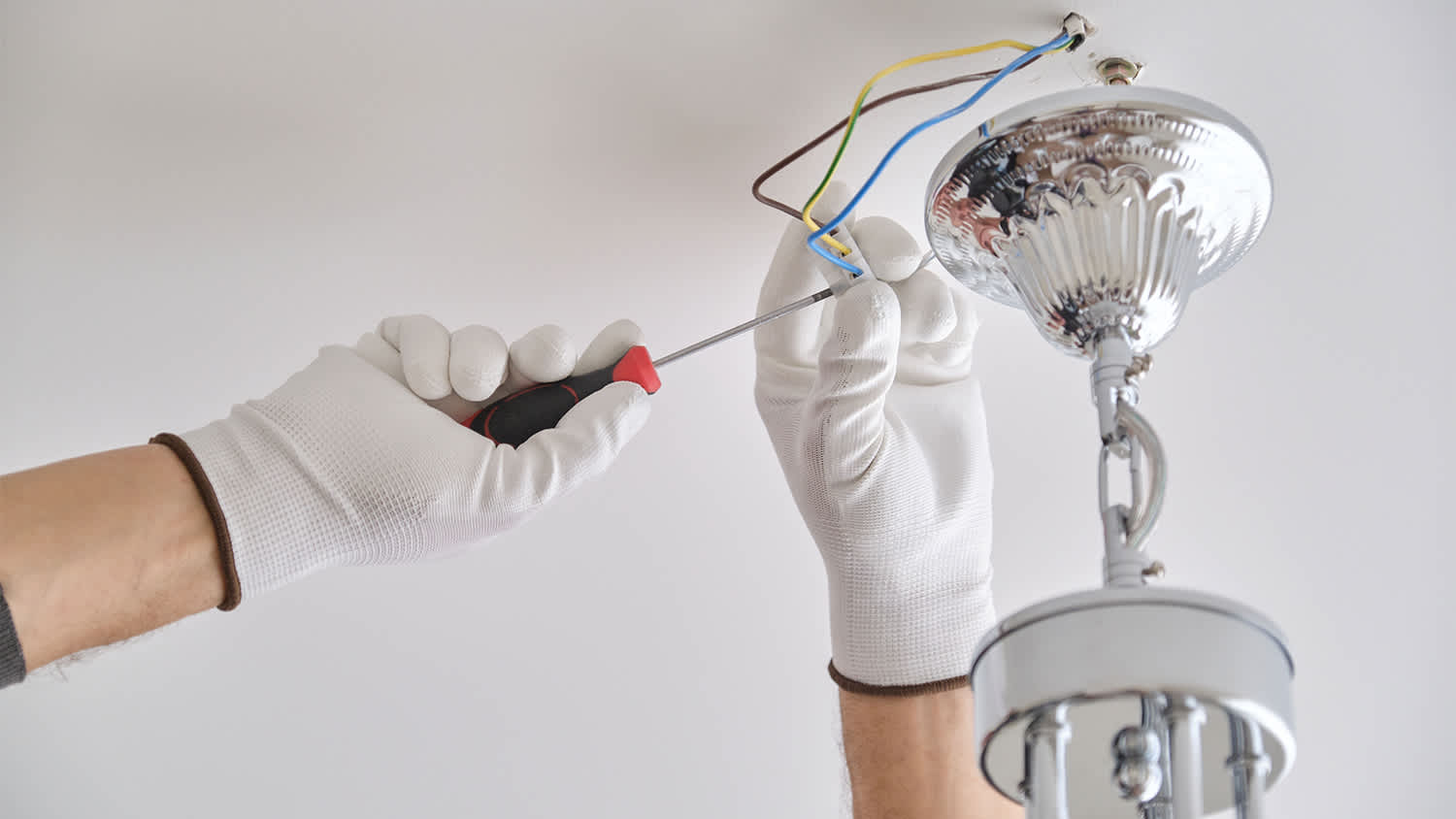 technician working on ceiling wires